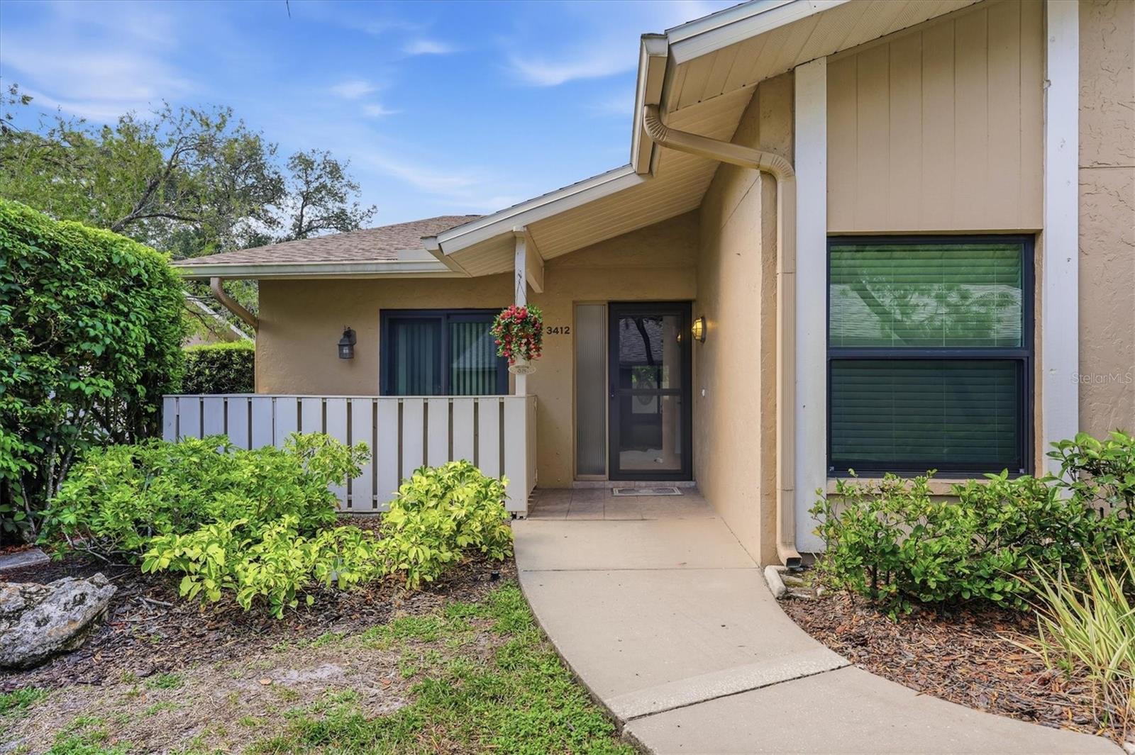TALLYWOOD-A 55+ CANOPY TREE SHADE Villa community close to The Orioles ball park, Bobby Jones Golf Course, Downtown Sarasota, Lido/St. Armand's and UTC!  This is the largest floorplan available at the Villas in Tallywood with just under 1700 square feet! The MAIN LEVEL has a PRIMARY bedroom suite, guest bedroom/bathroom, CATHEDRAL CEILINGS in the living room/dining room, LARGE KITCHEN AND there is a LOFT/3rd bedroom upstairs with LOADS OF STORAGE. Updates include new HURRICANE WIND RATED WINDOWS AND SLIDERS THROUGHOUT, hot water tank is 3 years old, most appliances are 3-6 years old. There is a transferrable home warranty that conveys with the home till the end of the year 2026. You have a beautiful lanai plus plenty of open parking PLUS your own carport with more storage! Tallywood boasts a large Olympic size pool, clubhouse with gym, library, community kitchen for events, shuffleboard, etc. Priced right @ $284,500. Don't let this one slip away!