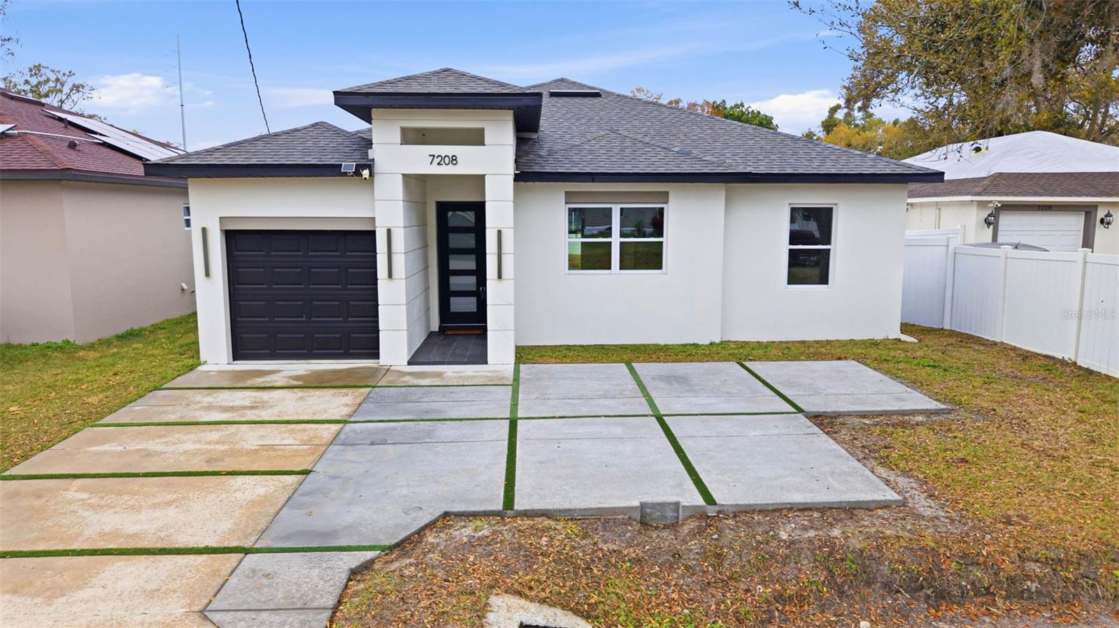 UNBEATABLE BUILDER INCENTIVES IN TAMPA 
Move into this gorgeous, brand-new home  skip the high market payments! The builder is paying your closing incentives to give you:

1-A promotional 4.4 interest rate for the first year (2-1 Buydown).
2-$0 Monthly Mortgage Insurance (PMI) for life (Single-Premium paid by seller).
Save over $820 a month in your first year! Move-in ready and waiting for you. 

HOME WITH 1 YEAR WARRANTY WALL TO WALL PLUS 10 YEARS ESTRUCTURAL WARRANTY HUGE PARKING SPACE IMPROVEMENT YOU MUST TO SEE, NOW ADDITIONAL PARKING SPACE FIT UP TO 4 CARS 

Rare Opportunity – Brand-New Construction in Tampa! Why settle for a resale when you can own a completely brand-new home built ? This stunning residence offers the perfect combination of modern design, high-quality craftsmanship, and peace of mind that only new construction can provide. Featuring 3 bedrooms and 2 bathrooms, this home was built with attention to detail at every step. Enjoy impact-resistant windows, beautiful waterproof laminate flooring, and soaring high ceilings that create a spacious, airy feel. The open-concept layout seamlessly connects the living, dining, and kitchen areas—perfect for today’s lifestyle. Step outside to your private vinyl-fenced yard, ideal for relaxing, entertaining, or simply enjoying your own retreat. Located in the heart of Tampa, this home puts you close to everything—just 15 minutes from Downtown Tampa and 20 minutes from the airport. Shopping, dining, and entertainment are all just minutes away. Opportunities like this are hard to find—everything is new, never lived in, and move-in ready. Don’t miss the chance to make this modern 2024-built home yours!
