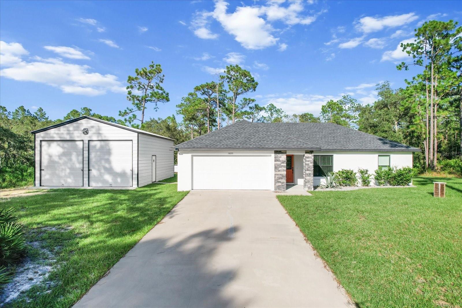 Welcome to this stunning 2021-built home located in the peaceful community of Crystal Manor, Florida. This barely lived-in 3-bedroom, 2-bathroom gem offers modern living in a serene, quiet neighborhood, just minutes away from the pristine waters of Lake Rousseau and Withlacoochee River — both popular spots for boating, fishing, and enjoying nature. The open-concept layout features vaulted ceilings and spacious living areas, creating a bright and airy atmosphere. The well-appointed kitchen is great for preparing meals and entertaining guests with granite countertops, stainless steel appliances, and a large island for extra prep space. Also enjoy a 24x35 Workshop – A dream for hobbyists, crafters, or anyone in need of extra storage space. his property is an ideal choice for those seeking a modern home in a serene, nature-filled location. Don’t miss the opportunity to make this beautiful Crystal Manor property yours!