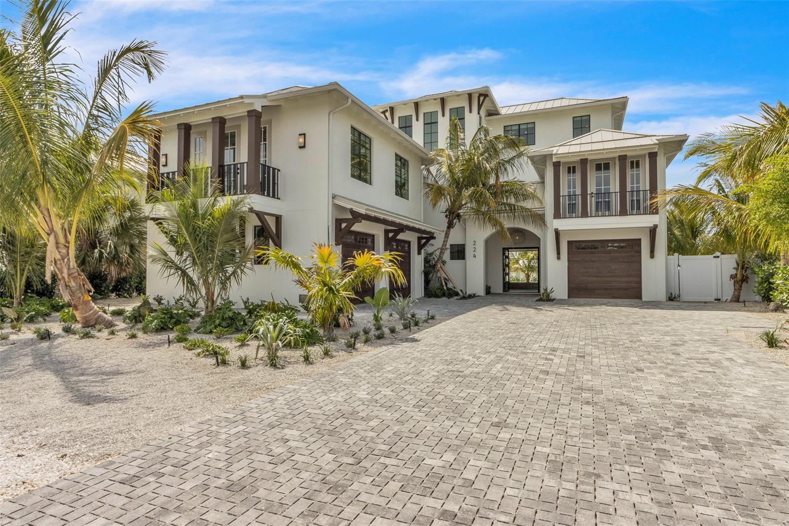 Step into unparalleled luxury with this fully furnished, 6-bedroom, 7-bathroom deep-water canal-front estate, perfectly situated just two blocks from the pristine sands of Anna Maria Island. This isn’t just a home, it’s a statement, and a legacy investment all in one extraordinary package.

Crafted with full concrete block construction, this residence is engineered for strength, security, and longevity, featuring hurricane impact-rated windows and doors and a Cat 5-rated roof. Every detail has been designed to provide absolute peace of mind, whether you’re seeking a lavish year-round retreat or a premium income-generating property.

Inside, the home is a masterclass in modern coastal elegance. Soaring ceilings, expansive walls of glass, and curated designer lighting flood the interiors with natural light, creating an atmosphere of serene sophistication. The gourmet chef’s kitchen is a showpiece, boasting custom cabinetry, dramatic quartz countertops, a sculptural concrete range hood, a full Sub-Zero appliance suite, and a hidden walk-in Butler’s pantry, blending beauty with function flawlessly.

Every space has been thoughtfully curated from the open-concept living and dining areas to multiple covered balconies and loggias that embody effortless indoor-outdoor living. The primary suite is a sanctuary, complete with a spa-inspired bathroom, walk-in closet, and private balcony overlooking the sparkling water.

The rooftop deck is an entertainer’s dream and a private retreat all in one. Designed for gatherings under the stars or quiet moments of reflection, this oversized outdoor space offers panoramic views of the canal, the island, and golden Gulf sunsets, with multiple seating and lounge areas for ultimate comfort and luxury.

Step outside to your private tropical oasis. The backyard features a resort-style pool and spa, lush palms, and generous lounging areas, all framing a deep-water canal with direct, bridge-free access to the Gulf of Mexico, making it perfect for boating enthusiasts.
Offered fully turnkey furnished, professionally designed with luxury pieces throughout, this home allows immediate enjoyment or a high-end rental income stream. With demand for premium Anna Maria Island vacation homes at an all-time high, this property offers both an unmatched lifestyle and an exceptional investment opportunity.
Words and photos only hint at the experience. To truly appreciate the craftsmanship, scale, and sheer beauty, a private tour is essential. Don’t miss your chance to claim this crown jewel of Anna Maria Island.
Schedule your exclusive showing today.