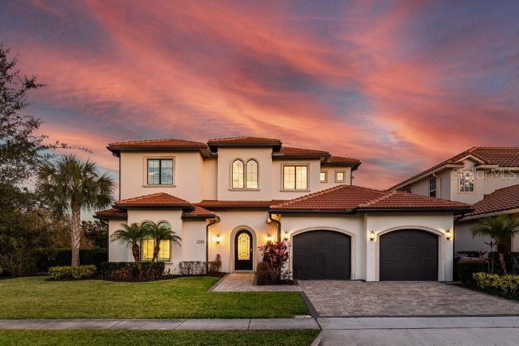 Luxury, Lifestyle and Legacy are on full display at this immaculate custom-built home. Covered SCREENED around CUSTOM POOL area. SUPER rare in Reunion. No detail was left behind when creating this MCNALLY BUILD MASTERPIECE. Come experience this 5-bedroom custom property located in one of Central Florida’s most premier communities, Reunion. This home is overlayed on an oversized lot and is truly a presence in the community. This is a golf course view home that looks, feels, and represents the very best of builds. Once you cross over into the home you are instantly swept away by a large entrance, natural light and an inviting open space that feels different than everything else out there. The home includes clean lines, perfectly chosen décor, along with a bright and playful color palette that excites all those who enter. The open floor plan and high custom accented ceilings make you want to see more. When you find your way into the kitchen it's apparent that it is well equipped and does not disappoint. With custom countertops, backsplashes, and cabinetry it is sure to be the focal point of all your events. The kitchen also showcases a separate wet bar that by day is the perfect spot to brew your favorite cup of coffee, and by night is where you can showcase your favorite libation. The garage is a true two car garage with a finished floor. There are two bedrooms on the first floor. One of them being the master’s quarters that has two private closet areas, a large shower and a deep soaking tub. The highlights continue to the pool and spa area that has a ONE-OF-A-KIND enhancement NOT FOUND anywhere else in Reunion. The pool and spa space does have a custom screen that is part of the structure.  A must for those who love to enjoy the best of Florida indoor and outdoor living and still be in your own private space. There is a private modern feel, with outdoor entertainment and lounging space that includes a stout summer kitchen. The space is timeless and this feature that unifies the home and pool area into one. The elegance and function carry on to the second floor with more gathering space and a highly functioning entertainment area. A large loft with a billiards table, comfy couch and entertainment center is on display and washed over again with tons of natural light. This is where you will also find a playful take on high class custom train car bunkbed room, ALL ABOARD. The rest of the bedrooms are well sized and include very tasteful and upscale décor. It is important to mention that they each including their own bathroom and closet space. The upstairs also has a large balcony and seating area perfect for coffee in the morning and watching those who grabbed an early tee time roll in. The home is located on TWO golf holes, the 7th and 8th of the Watson Golf Course. The balcony also serves as a wind down perch for a glass of wine to watch the stars dance in the Florida night sky. There is an *Active Reunion Resort Membership* available on this property. If you are looking for the truly custom livable elegance in Reunion, you have found it.  Reunion Resort has everything you want in a community including 3 signature golf courses, world class dining, waterparks, lazy river, water slides, firework viewing areas, tree lined streets, dog park, playground, golf simulator, member events, in-resort shuttle service, and event space and close to all the major attractions. Keep in mind this home cannot be replicated for this price point.  Come see it!