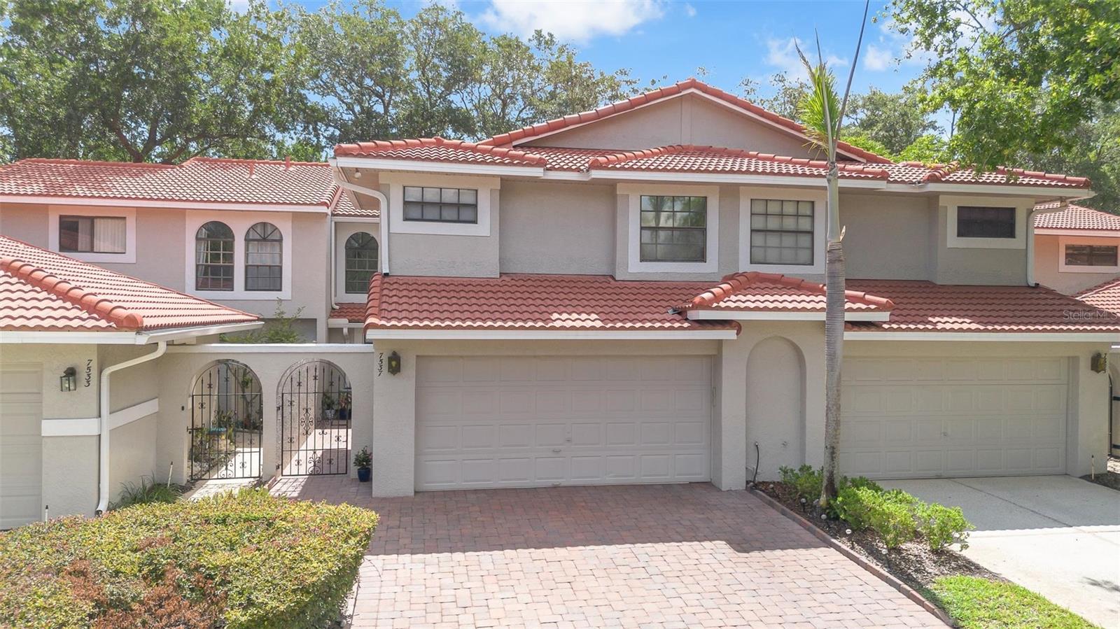 Welcome home to your completely updated & largest floor plan available with private wooded views & no rear neighbors, in the highly desirable gated Sandpointe townhomes in the heart of Dr. Phillips. The upgraded brick paver driveway with widened entry leads to your secure & gated courtyard; the ideal location for a cook out to a personal garden. Upgraded waterproof Courtier Luxury Vinyl Plank LVP flooring extends throughout this spacious floor plan leading to your family room, dining room & professionally enclosed 26'x9' Florida room; adding approximately 220 S.F. of usable living flex space; ideal for a supervised play room, home offices, game room, home gym or yoga / art studio with serene & inspiring views of your private wooded backyard & bird sanctuary. The reconfigured & functional gourmet kitchen is a chef's dream come true & features Quartz counter tops, upgraded cabinets with soft close doors & drawers, 2 closet pantries with wood shelving & pull out drawers & a corner cabinet Lazy Susan to maximize storage. The adjacent breakfast nook leads you to the courtyard through sliding glass doors making it ideal access to your BBQ grill, while the extended breakfast bar is the ideal location to serve guests your most tantalizing culinary creations. The guest half bath is privately tucked away next to the staircase that features a shelved under stairs storage closet. Stained red oak steps lead you to the second floor with extended LVP throughout and to the over sized master retreat that features a rare 8'x15' bonus flex space that is ideal for a baby nursery, an office, or mediation retreat to enjoy your favorite book. A charming barn door leads you to your private spa inspired en-suite bath & an oversized shower with triple shower heads, floor to ceiling tile, recessed shelf & convenient built in bench. The spacious walk-in closet features a very functional organizer system that is sure to satisfy the most discriminating fashionista. A dual sink vanity with Quartz counter tops is located next to the private water closet. Bedrooms 2 and 3 both feature serene wooded views, upgraded cellular shades with one black out shade and built-in closets with customizable organizer systems. Make this turn key townhome with a brand new tile roof in 2021 conveniently located around the corner from the community amenities yours today. Sandpointe Townhomes HOA offers a club house with a kitchen, a heated community pool, fitness studio, Bocce Ball court & tennis courts. Resort style living in a gated community with the HOA taking care of the exterior & roof maintenance, all the lawn maintenance plus a termite bond for your peace of mind. Enjoy the security of gated community ideal for your daily walks or runs or an evening stroll to Trader Joe's & The Parkside community park which are around the corner. The Marketplace is minutes away featuring a wide array of shops & restaurants including the brand new Crunch Fitness, Christini's Ristorante Italiano, a Greenwise Publix, Starbucks, Home Goods & Home Sense for your last minute shopping needs. Preview your favorite book at Barnes & Noble, or visit one of the many restaurants on the famous Restaurant Row to curb any craving you may have. Dellagio is also around the corner offering specialty restaurants such as Dragonfly Sushi & Fleming's Steakhouse for a great happy hour. All this in quite possibly 1 of the best locations in SW Orlando, close to major highways, shopping malls & all the area attractions