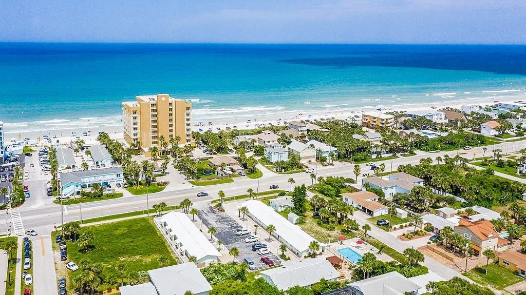 Positioned in one of Florida’s fastest-growing coastal markets, this newly renovated beachside motel presents a rare opportunity to invest ahead of New Smyrna Beach’s next wave of growth. With eleven guest suites, pool, patio, and laundry, this motel is a turnkey investment opportunity. The current owners have done the hard work of renovating, so you have the chance to turn this into an income producing investment.
Over the last five years, New Smyrna Beach has experienced nearly 10% population growth, with continued expansion projected as the transformative Deering Park development moves forward—bringing thousands of new residential units, millions of square feet of commercial and industrial development, and substantial new employment opportunities to the area. 
Already recognized as one of Florida’s premier beach destinations, the New Smyrna Beach Area Visitors Bureau reported over 813,000 visitors in 2025 alone, further reinforcing the area’s strong tourism-driven economy. Average summer weekends bring an estimated 20,000–40,000+ additional visitors to the area, while major holiday weekends can exceed 50,000–80,000+ visitors throughout New Smyrna Beach and surrounding coastal communities. 
As buyers and investors continue seeking alternatives to established luxury coastal markets such as Ponte Vedra Beach, St. Augustine, Amelia Island, Singer Island, Key Biscayne, and Delray Beach, New Smyrna Beach is increasingly positioned for similar long-term appreciation and demand. With limited hotel inventory, expanding infrastructure, strong tourism, incoming jobs, and a rapidly growing market, opportunities to acquire renovated hospitality assets in this location are becoming increasingly limited.