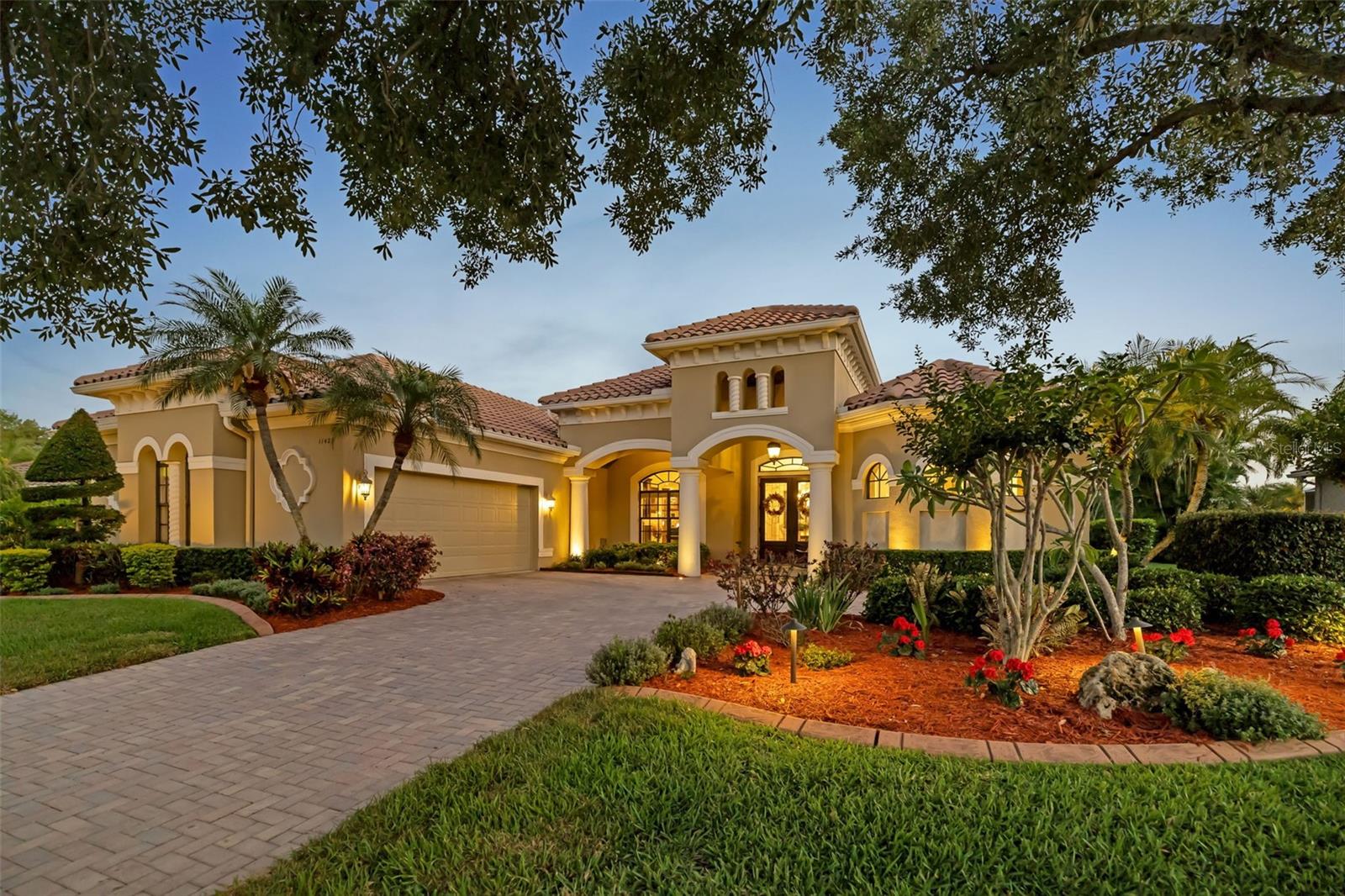 Savannah Lakes at River Wilderness presents an exceptional opportunity for homebuyers seeking a secure, gated community in Parrish, Florida. This south-facing property delivers modern energy efficiency with newly installed 2024 solar panels that significantly reduce monthly electricity costs. Climate control infrastructure updates include a recently replaced HVAC system and fully sanitized air ducts. Inside the split-floorplan layout, double front doors lead to functional living spaces featuring custom closets, a custom walk-in pantry, and a remodeled guest bathroom with a modern walk-in shower. The central kitchen accommodates large gatherings and flows into the outdoor living area via corner pocket sliding glass doors. This architectural design blends indoor spaces with a covered lanai and fully equipped outdoor kitchen, perfect for enjoying the Florida climate. Outside, the home's curb appeal features a paver driveway, nighttime exterior lighting, and a side-load garage equipped with a dedicated golf cart extension (separate entry door) that creates plenty of extra storage. As a private enclave within the River Wilderness gated development, Savannah Lakes offers large lots and rural tranquility at a lower cost than nearby Lakewood Ranch real estate. The community provides easy access to local Parrish parks, grocery stores, dining, and home improvement retailers. Residents also benefit from proximity to Anna Maria Island beaches and straightforward commuter routes to St. Petersburg, Tampa, Sarasota, and Bradenton.  Do yourself a favor and come check out what this home in Savannah Lakes at River Wilderness and checkout the value this presents!