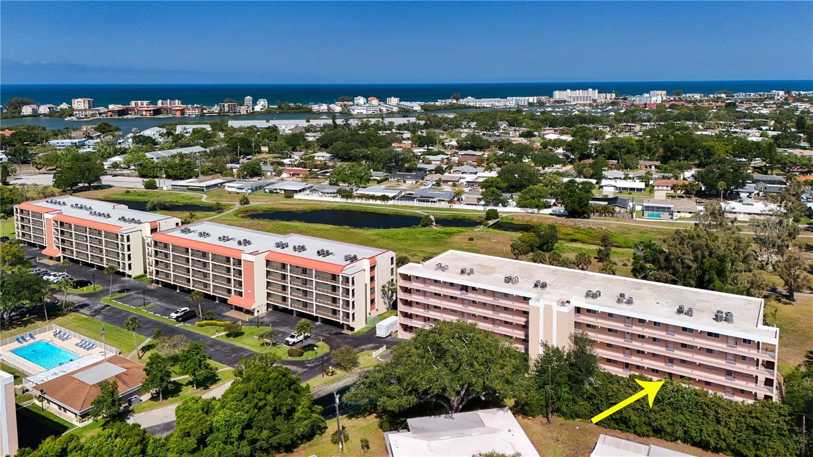 What an absolute hidden gem in Seminole.  ALL AGES WELCOME!!!!, located very close to the beach, restaurants and shopping, this condo is located right next to the bay point conservation area with gorgeous trails for hiking, running, biking and just enjoying the outdoors. This condo is pet friendly, There is an elevator,  featuring 2 bedrooms, 2 bathrooms, large kitchen, beautiful tile floors, indoor utility closet with full size washer and dryer, large bedrooms, primary has walk in closet and it's own ensuite, and primary opens to the large balcony/florida room perfect way to start the day with your coffee and gorgeous views.  Expansive balcony on the back of the unit positioned perfectly to watch the sunset with no rear neighbors for great views and lots of privacy.  A/C is newer as is water heater  condo features under building parking, large storage unit next to parking stall, clubhouse with beautiful pool. guest parking, beautiful fountain in front of the building, this condo has it all !!!!!!!!