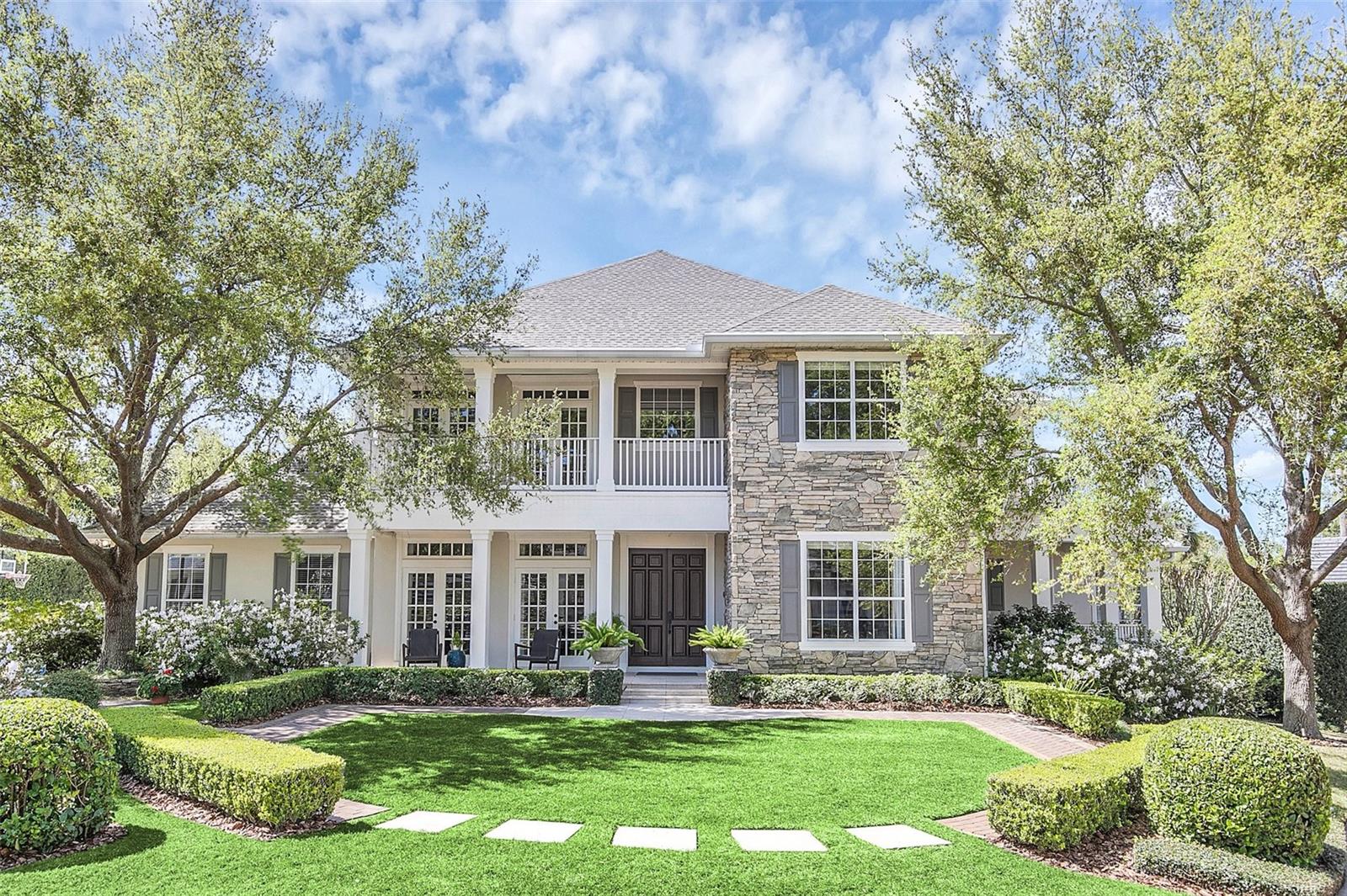 Welcome to your dream home nestled in the sought-after prestigious gated community in a Winter Park/Maitland blended neighborhood with deeded boat slips on Lake Maitland, providing boating access to the six-lake Chain of Lakes! This exquisite, one-owner, custom-built true five-bedroom traditional Charleston-style residence, built in 2001, boasts unparalleled elegance and pride of ownership. Lovingly cared for by one family over the years, the home offers a rare opportunity to purchase in this unique gated community with only eight residences. As you step through the front door, you'll be greeted by the charm of the formal library and dining rooms, creating a perfect setting for entertaining guests. There are numerous amenities beyond the gated entrance, including a walkway to Lake Maitland, individual boat slips, and an oversized community lawn that creates a park-like setting to enjoy by the lake. The main gathering room, sunroom, and bonus room offer versatile spaces for relaxation and recreation, while the dedicated fitness room caters to your active lifestyle. The first-floor primary suite is a true retreat, featuring views of the 45 by 10-foot lap pool and a meticulously landscaped backyard. The spacious island kitchen with a breakfast area provides a welcoming space for culinary creations, with easy access to a covered outdoor living area for al fresco dining. Step outside and discover your own private oasis – an outdoor cabana complete with a fireplace and TV, perfect for outdoor entertaining with a lushly landscaped perimeter. Roof was replaced in 2022. Both air conditioning units were replaced in 2015, newer appliances. This residence offers tranquility and exclusivity that is rare to find. Embrace the great outdoors and create lasting memories by the water. Beyond the gated community, this home is ideally situated for convenience to local area restaurants, Park Maitland School, and the famed Enzian Theatre. A short bike ride takes you to the renowned Winter Park's Park Avenue, offering upscale shopping, dining, and cultural experiences. With top-notch schools and easy access to major roadways, this location seamlessly combines luxury living with practicality. Don't miss the chance to make this exquisite property your own – where elegance meets comfort, and every day feels like a vacation. Room Feature: Linen Closet In Bath (Primary Bedroom).