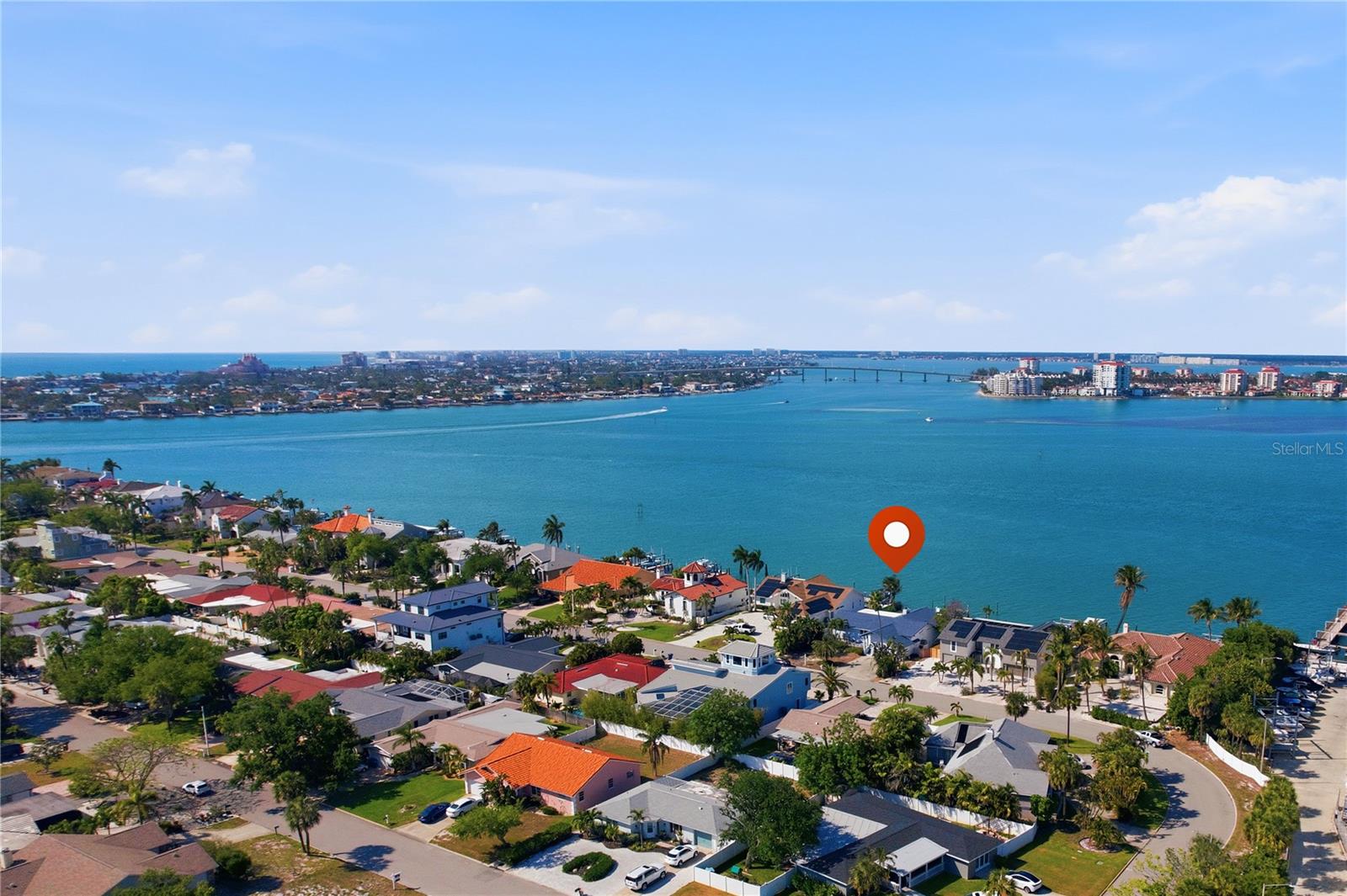 One or more photo(s) has been virtually staged. Stunning views over Boca Ciega Bay from this lot in one of Pinellas County's most desirable locations. Conveniently located in the no-wake zone, this is a rare opportunity to have both wide open-water views and reasonable boating. The existing home suffered roof damage but no flooding. The roof has been repaired and the interior remediated, so a buyer could add custom finishes and have a great open water home for a reasonable price, but the lot's location and views would support a new luxury home of the highest caliber.