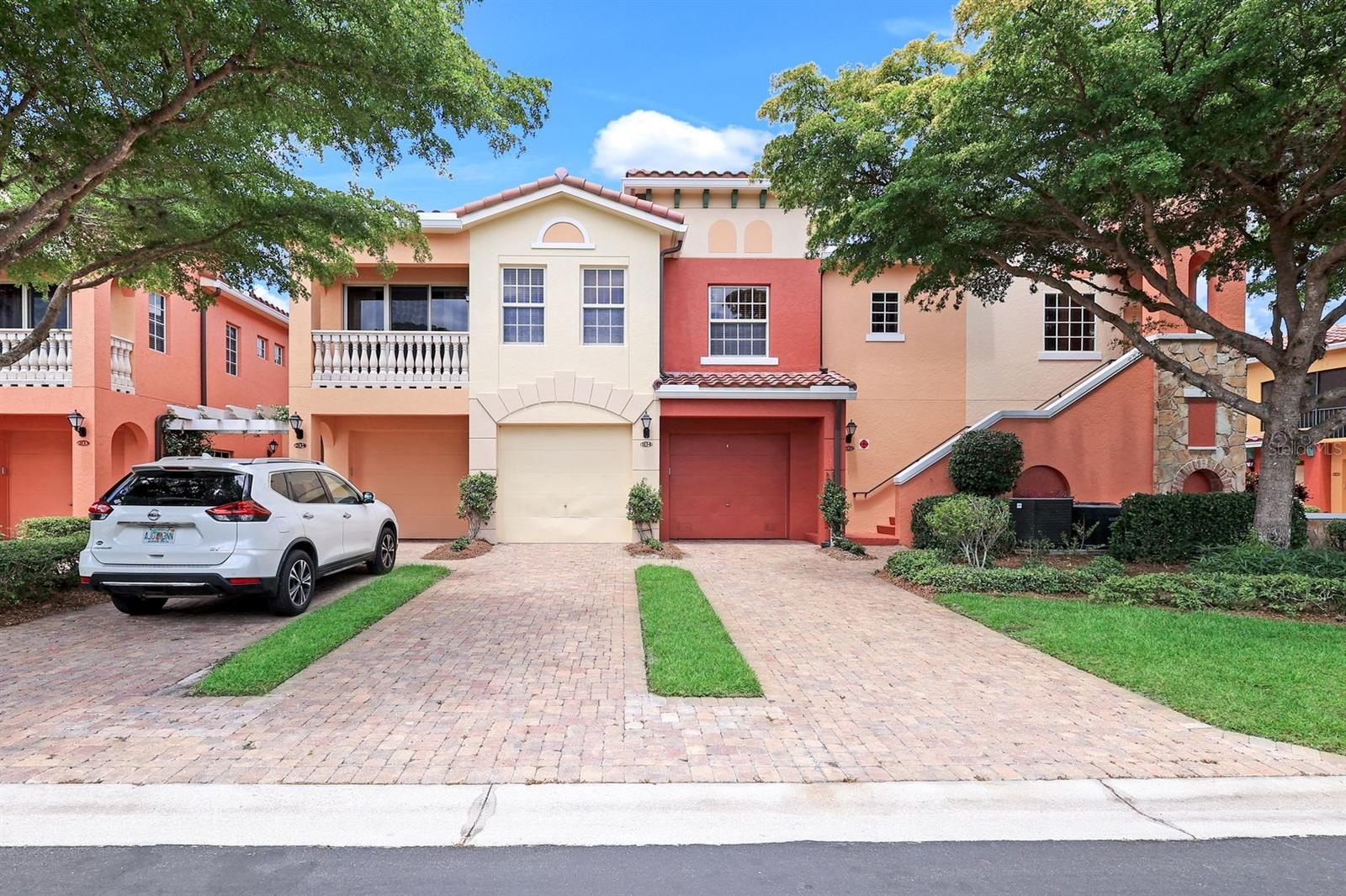 """END-UNIT COACH HOME"""....."""STEPS TO THE LAKESIDE POOL"""....."""TURNKEY FURNISHED"""....."""IMPECCABLY MAINTAINED"""....."""LIGHT & BRIGHT"""....."""LAKE VIEWS FROM THE FRONT AND THE BACK LANAI""" Spacious 3BR / 2BA / 1-CAR ATTACHED GARAGE Coach Home featuring the desirable Chiavari floorplan offers approximately 1,612 SQ. FT. UNDER AIR and a TOTAL OF 2,128 SQ. FT., and is MOVE-IN READY for immediate enjoyment. Designed for comfortable living and effortless entertaining, this residence showcases an open-concept layout filled with natural light. The living space flows seamlessly to the private lanai, where you can relax and take in peaceful lake views. ""IMPACT-RESISTANT WINDOWS and DOORS THROUGHOUT"" provide added peace of mind, while the TURNKEY FURNISHED offering allows for a smooth and convenient transition into your Florida lifestyle. Located in the highly sought-after, gated community of Rapallo at Coconut Point, residents enjoy an exceptional resort-style setting featuring a beautifully appointed clubhouse with social and dining spaces, lagoon-style pools and a signature rock grotto spa, a full-service fitness center, sauna, and an Olympic-size lap pool. Outdoor enthusiasts will appreciate the active tennis program with HydroCourts and stadium seating, as well as bocce courts, scenic walking paths, botanical gardens, and tranquil stocked lakes throughout the community. Just a short walk to Coconut Point for upscale shopping, dining, and entertainment, and only minutes to Southwest Florida International Airport, Miromar Outlets, Gulf Coast Town Center, and Florida Gulf Coast University — plus Southwest Florida’s beautiful sugar sand beaches. Whether you're searching for a full-time residence or the perfect seasonal retreat, this home delivers the ideal blend of comfort, convenience, and effortless Florida living in one of Estero’s most vibrant communities