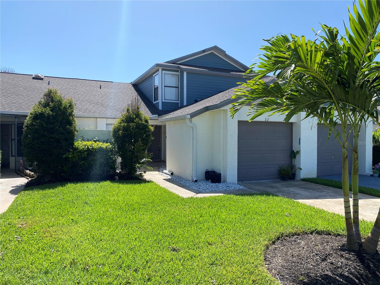 Magazine-worthy elegance meets serene waterfront living! This meticulously maintained 3-bedroom, 2.5-bathroom townhouse with a 1-car garage is nestled in a quiet, established Kissimmee community, perfectly combining peace with unbeatable Central Florida convenience. Located just minutes from the magic of Disney Parks and the vibrant dining, shopping, and entertainment districts of Lake Nona, you will also enjoy seamless commuting with effortless access to the 417, I-4, and 408 expressways.Step inside to discover a flawless, light-filled floor plan designed for effortless flow. The immaculate chef’s kitchen boasts premium granite countertops,and newer 4 piece appliances. Significant capital improvements offer total peace of mind, featuring a newer roof (2020) and a updated HVAC system (2017). Elegant upgrades continue throughout the home, from the beautifully modernized bathrooms to the laundry room equipped with washers and dryers.The sophisticated flooring features low-maintenance ceramic tile across the main level, a stunning custom wood staircase, and specialized, moisture-resistant wood-look tile handling the upper floor. Retreat to the highly coveted first-floor primary suite, where large windows frame breathtaking, tranquil lake views—the ultimate inspiration to start your day. Step out onto your private, screened-in lanai to enjoy a peaceful morning coffee or an evening beverage against a quiet backdrop of water and nature. With the second and third bedrooms privately situated upstairs, this layout offers the perfect balance of space and privacy. This turnkey gem must be seen in person to be fully appreciated. Schedule your private tour today before it’s gone!