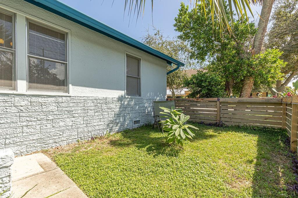Historic charm galore at this 100+ year old bungalow! Zoned T-4 and legal short-term rentals allowed as well as primary residence, office, retail and much more! Opportunity has come-a-knock'in! This fully furnished charmer is 100% turnkey! Original hardwood flooring, stunning craftsman style trim, wide open hallways, kitchen dining combo, functioning wood burning brick fireplace wall, huge mudroom with inside washer/dryer and water heater within, super cute front porch adorned with white gauze curtains and a gated fenced front yard with planter boxes of tropical and cactus plants. Back yard fenced with paver courtyard and brick fire-pit. One side of the shared double car garage conveys with sale. Roof, HVAC, water heater all within last 3 years, new sink fixtures, new lighting throughout, newer fencing and concrete countertops! Seller estimates $4k/monthly income with short term rentals. Walking distance to downtown the restaurants, bars, antique shops, coffee shops and parks lining Beach St along with tons of annual festivals, art shows, parades, all along the beautiful Halifax River! Take a stroll over to Jackie Robinson Baseball Park and catch a ball game while in town! Grab this one while it lasts! Opportunities are endless! Buyer to assume responsibility for performing all due diligence. All information and measurements taken from the tax roll and seller and while deemed reliable, cannot be guaranteed.