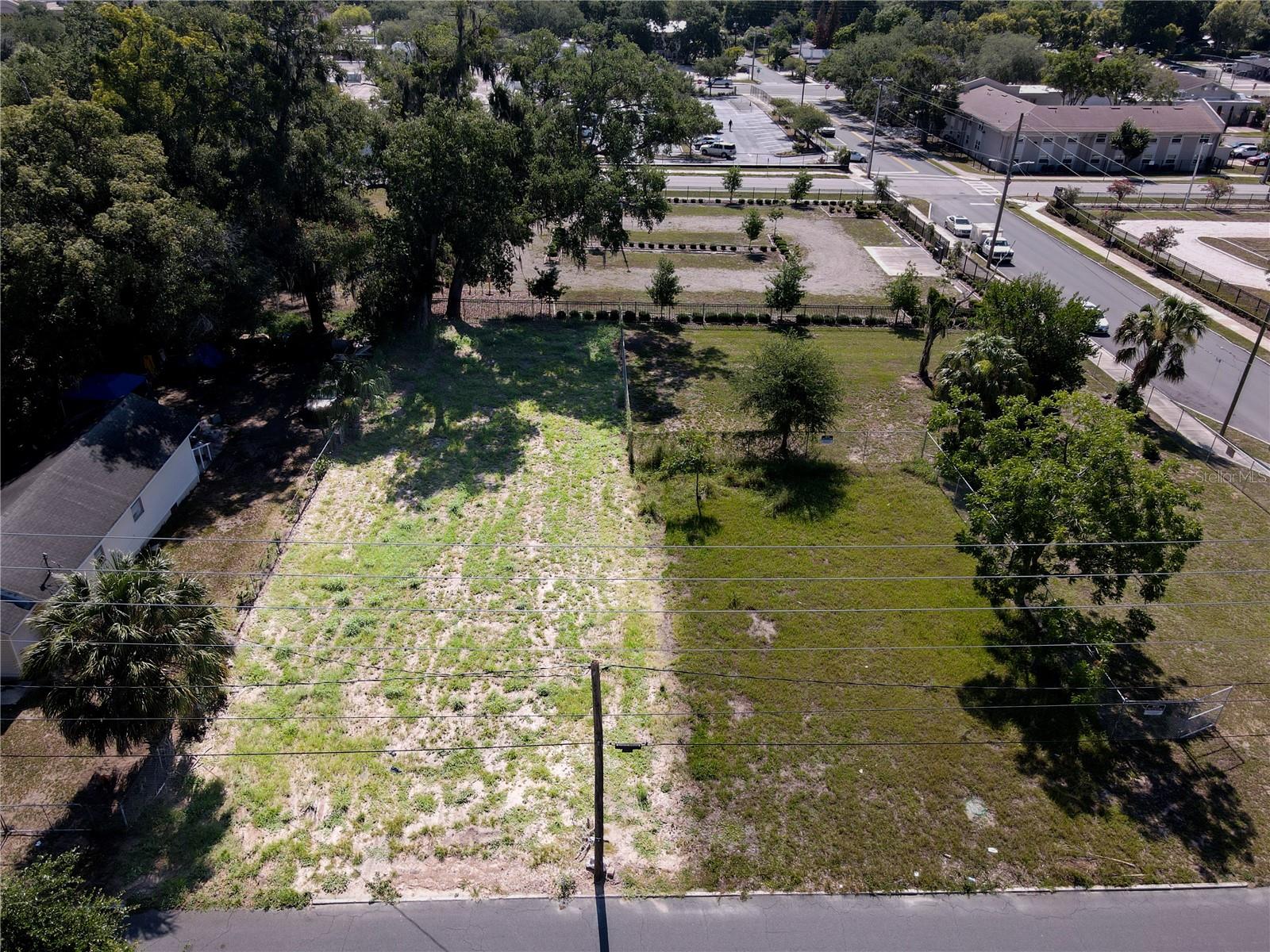 Commercially zoned redevelopment opportunity in Lakeland’s Midtown CRA. This vacant infill parcel features O-1 Office zoning, Residential High Future Land Use, and Urban Neighborhood (UNH) context district, creating flexibility for office, mixed-use, multifamily, townhome, residential above first floor, two-family, or single-family attached/detached development concepts, subject to City approval. Convenient location near Downtown Lakeland, major corridors, employment, dining, and services. Buyer to verify zoning, permitted uses, parking, utilities, CRA programs, and development feasibility with the City of Lakeland.