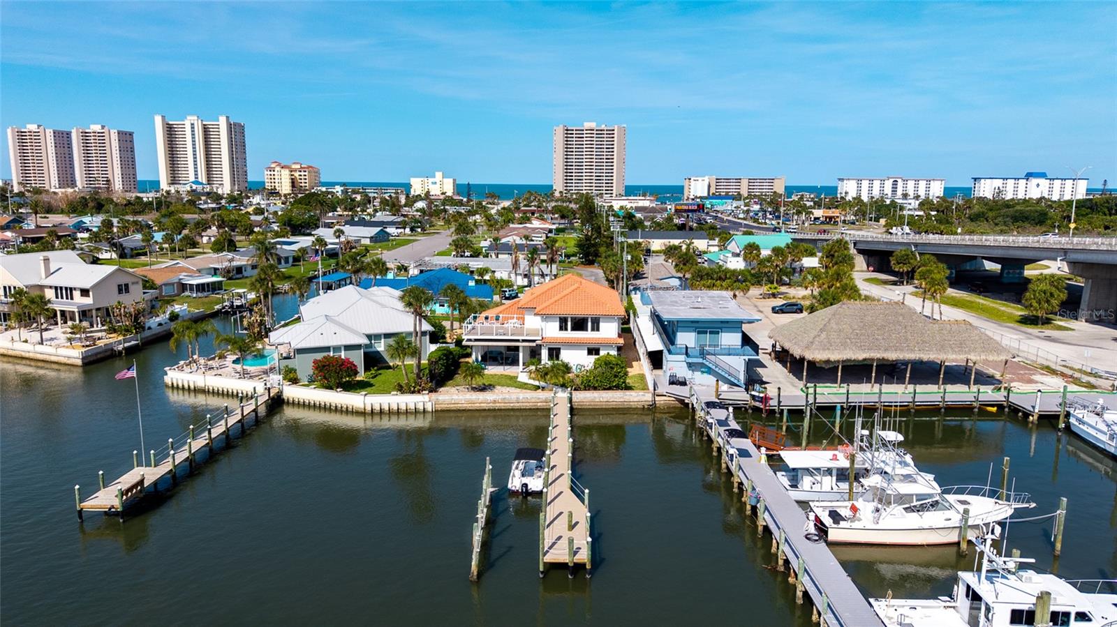 RARE INTRACOASTAL front Daytona Beach Shores/Ponce Inlet home 3 BLOCKS FROM OCEAN,  DIRECT HALIFAX RIVER & ATLANTIC OCEAN ACCESS,  NEW ROOF, NEVER FLOODED, NO HOA, NO RENTAL RESTRICTIONS, PRIME SECOND HOME & HIGH YIELD INVESTMENT OPPORTUNITY!

CUSTOM BUILT solid-construction waterfront gem offering the ultimate Florida boating lifestyle with unmatched second-home appeal and SERIOUS INVESTMENT UPSIDE.

Boasting 3,574 sq ft of living space, this 3-bedroom, 4-bathroom single-family home (built 1993) sits on an 1/4th acre lot in the peaceful, quiet cul-de-sac of Halifax Shores. The thoughtfully designed layout features a main-level primary suite for effortless living, two expansive upstairs bedroom suites with private baths, and a standout “River Room” perfect for sunrise coffee or sunset cocktails overlooking the water. Expansive entertaining space outdoors, while recent roof and AC updates ensure worry-free ownership. NO FLOOD HISTORY, direct Intracoastal frontage with a LONG PRIVATE DOCK – this is true deep-water boating paradise with NO bridges RESTRICTING ACCESS to the open Atlantic.

Perfect for the boating enthusiast and second-home buyer:

Picture effortless weekends or extended stays – launch kayaks, jet skis, or your center-console right from your backyard, cruise the Halifax River, and drop anchor for world-class fishing. Just minutes from Ponce Inlet and the Atlantic, yet tucked away in one of Volusia County’s most desirable waterfront pockets. This isn’t just a house; it’s your personal escape where family memories are made on the water, with easy access to Daytona Beach Shores dining, shopping, attractions, and 15 MINUTES FROM DAYTONA INTERNATIONAL SPEEDWAY. 

Real estate investors – this is your cash-flow machine with zero restrictions:
No HOA. No rental restrictions. Full Airbnb, VRBO, and short-term rental freedom. CAPITALIZE on SKY-HIGH DEMAND during DAYTONA 500, BIKE WEEK, BIKETOBERFEST, JEEP WEEK, and every major holiday. PRIME WATERFRONT LOCATION + OCEAN PROXIMITY = PREMIUM NIGHTLY RATES and YEAR-ROUND bookings from boaters, beach lovers, and event-goers. Strong appreciation in the Port Orange/Daytona Beach market, combined with low maintenance and high occupancy potential, makes this a turnkey investment that pays for itself while you enjoy it as a second home when you choose.

WATERFRONT HOMES with DIRECT INTRACOSTAL ACCESS, no HOA, and unrestricted rental potential are extremely rare and move fast in today’s market. Inventory is tight, buyer demand for boating lifestyle properties near the ocean in Florida is surging. Don’t let this one slip away – PROPERTIES LIKE THIS RARELY BECOME AVAILABLE.

Schedule your private showing today and secure your slice of Florida waterfront paradise. Live the boating dream, build family traditions, and watch your investment grow. Contact us now for details, virtual tour, or to make an offer on this one-of-a-kind Intracoastal opportunity blocks from the OCEAN before it’s gone!