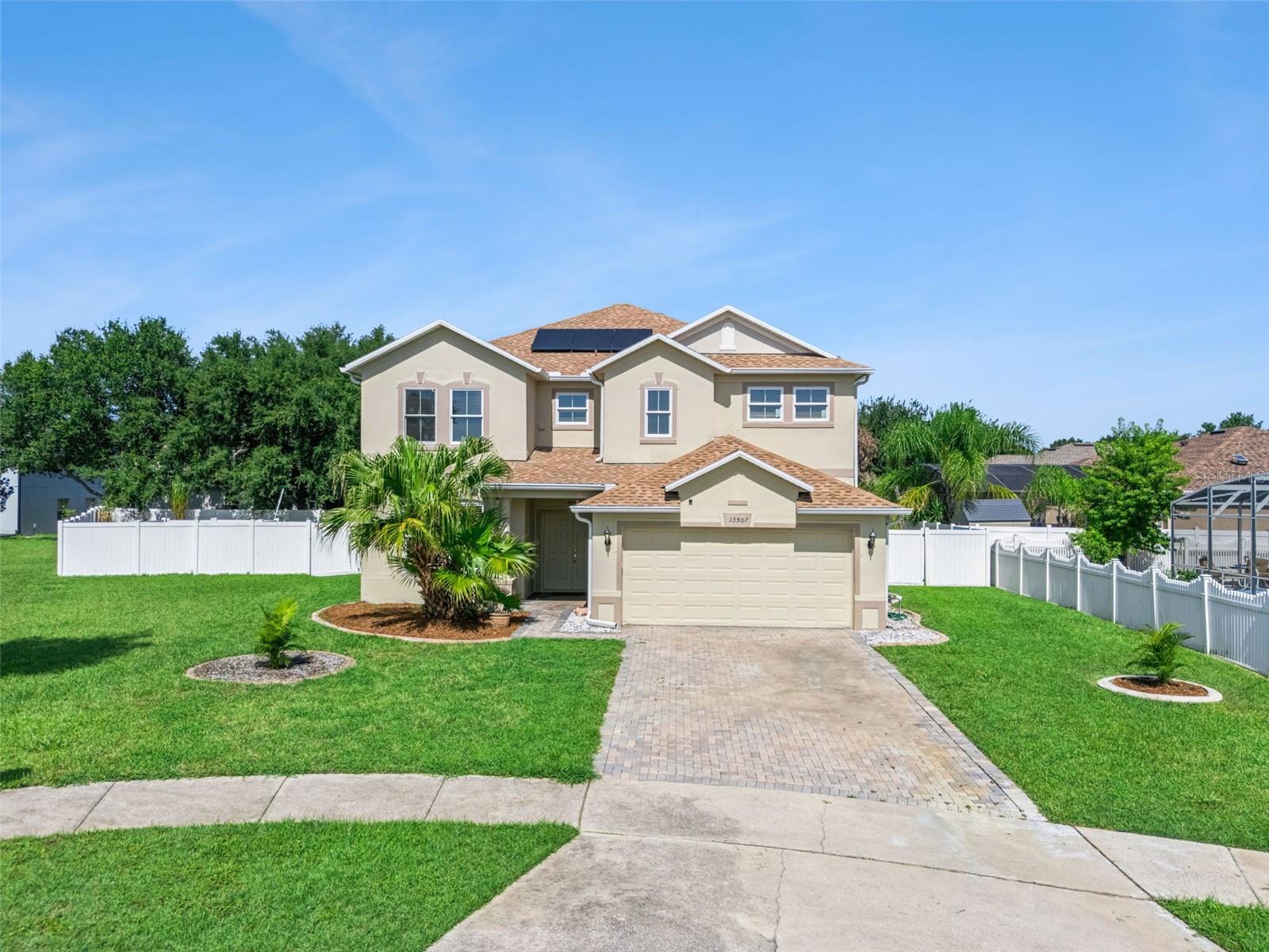 Fantastic opportunity to own this beautiful 4-bedroom, 2.5-bathroom, two-story single-family Pool home with a 2-car garage, offering 3,111 square feet of spacious living on an oversized cul-de-sac lot in the highly desirable Tradd's Landing community with low HOA fee. Priced to sell & Move-in ready, this exceptional home is ready for its next owner perfectly blending modern comfort and functionality. From the moment you step inside, you're welcomed by an open and inviting floor plan filled with natural light, enhanced by large windows and elegant dining room area. The first floor features a formal dining room & sitting area, downstairs bedroom can be a versatile office or flex space, convenient half bath, and a bright airy living room designed for both relaxing and entertaining. The large chef-inspired kitchen is a true centerpiece, showcasing wood cabinetry, LG stainless steel appliances, gas stove, spacious countertops, and abundant storage space, with walk-in pantry & breakfast area. Enjoy peace of mind with an impressive list of major upgrades, including a 2022 solar energy system, a 2023 NEW roof, 2023 Renewal by Andersen energy-efficient windows, 2023 Carrier 5-ton, 16-SEER high-efficiency HVAC system, 2020 generator wired 22 kW with Automatic Transfer Switch (ATS). Additional nice features include ceiling fans, sprinkler system, rain gutters, and a brick paver driveway. On the second level step into a large primary suite featuring a huge impressive walk-in closet, and a beautifully appointed grand bathroom with a soaking tub and separate oversized shower. The second floor also offers a big flex space bonus room, additional two bedrooms and a full bathroom that provides plenty of space for family and guests. The convenient private laundry room is equipped with updated Ai - LG washer and dryer that add everyday functionality. Step outside to the covered screened Pool deck and enjoy peaceful sunset views overlooking the expansive fully fenced backyard with storage shed. The oversized cul-de-sac lot offers ample room for privacy and entertainment, outdoor activities, or creating your dream backyard oasis. Enjoy the community amenities featuring a large community pool, children’s playground, and a lakefront dock. Conveniently located just minutes from US-27, US-192, and with easy access to FL-429 and I-4, this home offers quick access to Walt Disney World, Orlando Vineland Premium Outlets, dining, entertainment, and major employment centers. This is a rare opportunity you don't want to miss. Schedule your private showing today! All measurements, room sizes, and information are deemed reliable but should be independently verified by the buyer.