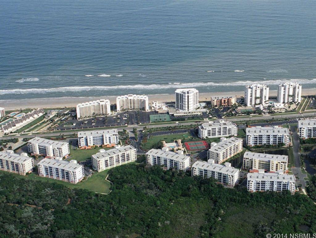 Beautiful sunset and estuary views from this well maintained 3/2. The unit is tastefully decorated and has a great rental history. Tile floors throughout the living area and kitchen with carpet in the bedrooms and a huge master bath. Hot water heater replaced in 2012. 2 outdoor landings 10 steps from your door to enjoy coffee in the morning. Don't have to use elevator, just a few steps to the second floor. Good rental history! Gross $20,000! Enjoy sunsets on your private balcony, and spend the day relaxing at the beach directly across the street via your private no drive beach access for Ocean Walk residents. Beach living at its finest! ;LocationDescription: Condo ;Water: City