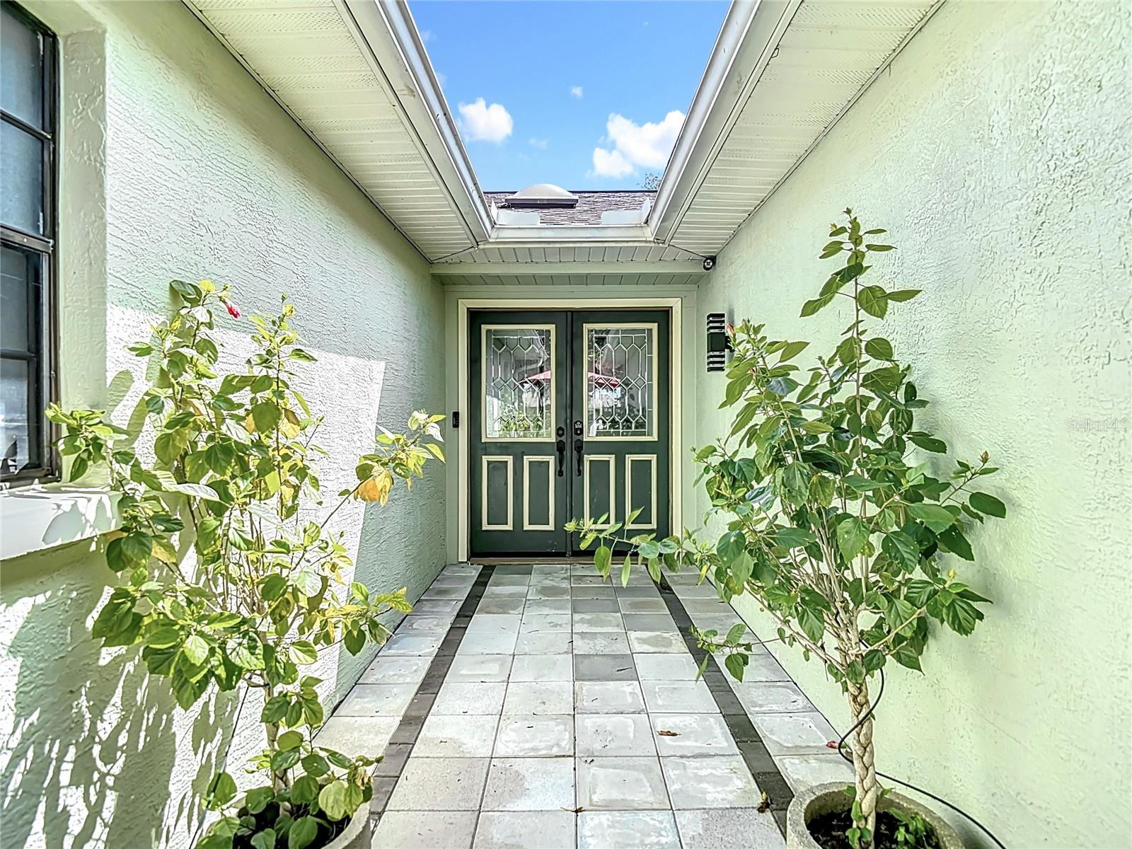Motivated Seller – Priced to Move! Welcome to a one-of-a-kind pool home that blends comfort, charm, and character on an oversized corner lot in one of Hudson’s most peaceful and inviting neighborhoods. From the moment you arrive, you're greeted by a quaint goldfish pond in the front yard—a serene and cheerful welcome that sets the tone for everything this home offers. Set on a quiet, tree-lined street with sidewalks ideal for morning walks or evening strolls, the location strikes a perfect balance between privacy and convenience. You’ll feel tucked away from the hustle and bustle, yet you’re just minutes from US-19, the Veterans Expressway, top-rated restaurants, shopping, and one of the area's best golf courses just down the road. The backyard is truly an escape of its own. Imagine gathering around a large fire pit set inside an expansive sand-filled enclosure that feels more like a private beach than a backyard. It's the perfect space for hosting, relaxing, or simply enjoying the Florida evenings. The sparkling pool offers year-round enjoyment and serves as the heart of this outdoor oasis. Inside, the home is thoughtfully maintained and full of inviting touches, with tasteful upgrades and decor that reflect the pride of ownership throughout. The layout is comfortable and functional, making it an excellent option for full-time living or a relaxing second home near the coast. This property is located in a non-flood zone and offers added peace of mind with an American Home Shield home warranty included with a full-price offer. It is also a professionally remediated sinkhole property, with full documentation available upon request. If you’ve been searching for a home that offers both lifestyle and location—this one is a must-see.