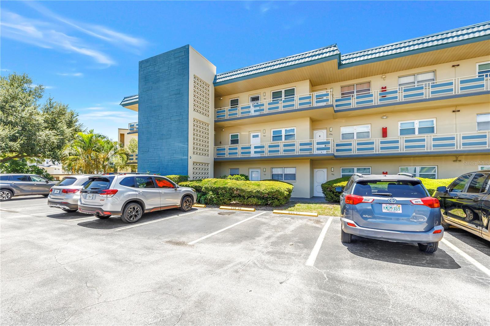 GROUND FLOOR UNIT – MOVE IN READY - with a great view and nearby dedicated parking! This highly desired FIRST FLOOR unit is overlooking a park-like setting, including a private patio area and greenspace. The open floor plan is light and bright. The great room is large and easy to entertain in. There is even a flex-space that can be utilized as an office or guest bedroom. Kitchen features a dedicated pantry. There is plenty of space to eat in the adjoining dining room. Bedroom is spacious and can accommodate large furniture and has a large walk-in closet. Bedroom flooring is new. Updated bathroom is complete with a tub shower combo and newer granite vanity. This gorgeous unit was freshly painted and is move-in ready! A quick closing is OK here! Low monthly HOA fees include building insurance and exterior maintenance, gas for cooking and heating, water, sewer, trash, cable and Internet are all included – SAVES YOU MONEY $$!! Five Towns has tons of social opportunities, and has extensive amenities including 6 pools (2 heated), a fitness center, card rooms, a billiard room, 2 tennis courts, pickleball, bocce ball, horseshoes, 10 shuffleboard courts, clubhouse/entertainment centers, multiple outdoor grill areas, and a car wash area. Close to restaurants, shopping and award-winning beaches.