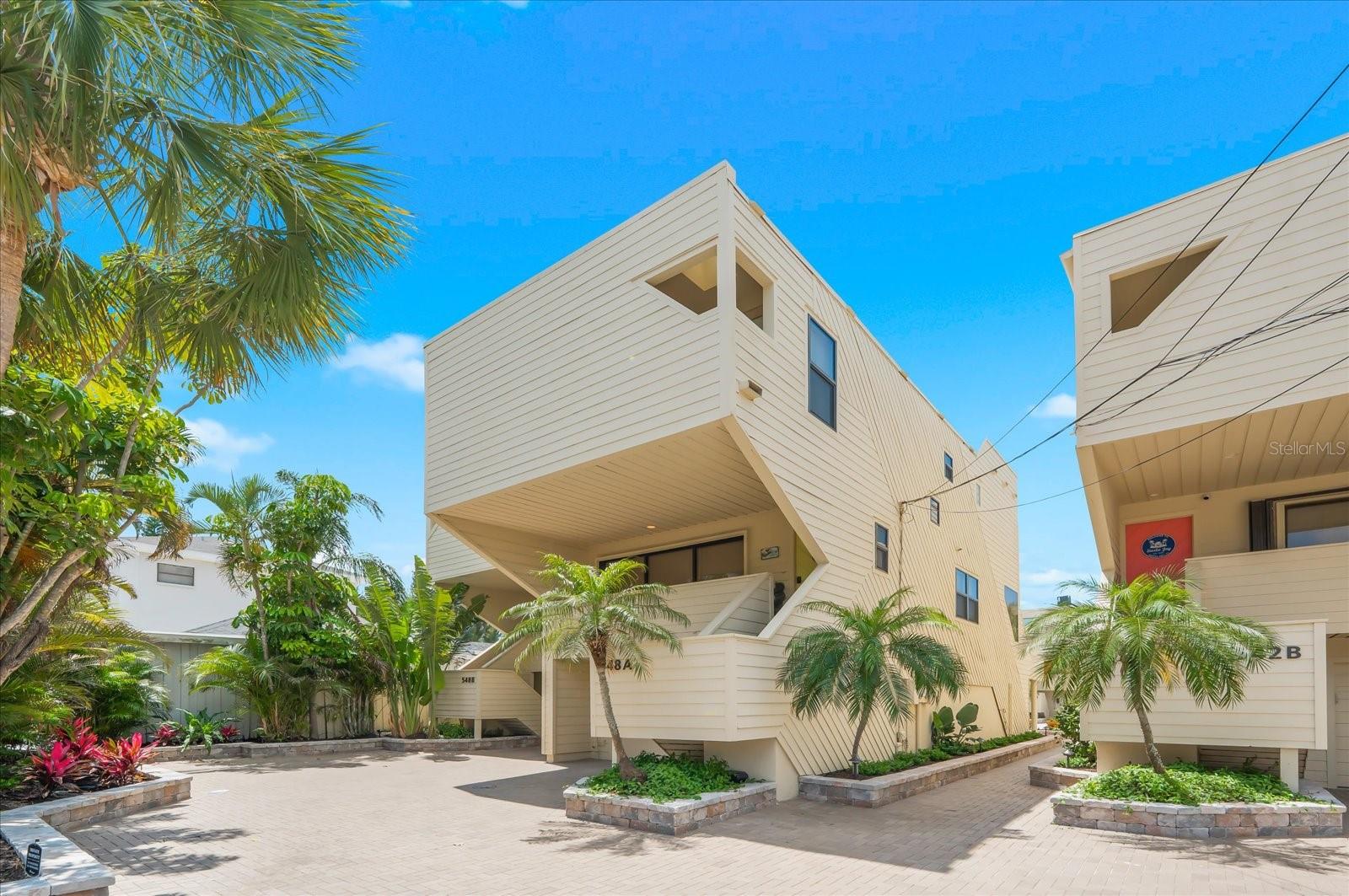 Beautifully renovated Tiffany Sands townhome offering the perfect combination of coastal elegance, spacious living, and an exceptional Siesta Key location with tranquil beach views. This 3-bedroom, 3.5-bath residence features an open, light-filled floor plan designed for effortless island living. Each generously sized bedroom includes a walk-in closet, providing ample comfort and storage.

A versatile first-floor bonus room with a full bath and private entrance offers endless possibilities as a guest suite, home office, media room, or additional living space. The home also features a one-car garage with extra storage, multiple expansive decks, and a private patio ideal for enjoying Gulf breezes and picturesque views of Siesta Key's turquoise waters.

Just steps away, deeded beach access leads to the world-famous quartz sand beaches of Siesta Key. Ideally situated near Siesta Key Village, residents enjoy convenient access to boutique shopping, acclaimed restaurants, entertainment, and everyday conveniences. Move-in ready and impeccably updated, this is a rare opportunity to own a stylish coastal retreat in one of Siesta Key's most desirable beachfront communities.