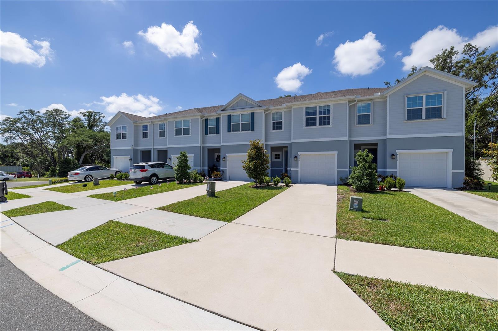 Virtually Staged. Welcome to **4298 Harbour Palm Drive**, a beautifully designed townhome in the sought-after Anclote Square community of Holiday. Built in 2023 with solid concrete block construction, this move-in ready residence offers the largest floor plan in the community, featuring 1,674 heated square feet, 3 bedrooms, 2.5 bathrooms, and a thoughtfully designed layout perfect for everyday living and entertaining.

Step inside to discover an open-concept floor plan with stylish tile flooring throughout the main level and abundant natural light. The chef-inspired kitchen is the heart of the home, showcasing granite countertops, custom wood cabinetry, bar seating, a spacious pantry, and plenty of prep space for cooking and gathering. The adjoining living and dining areas provide an inviting space for family and friends, while sliding glass doors lead to the covered rear patio where you can relax and enjoy the privacy of **no rear neighbors**.

Upstairs, the spacious primary suite offers a peaceful retreat with a large walk-in closet and an ensuite bathroom featuring dual vanities and a walk-in shower. Two additional generously sized bedrooms share a full bathroom, while the conveniently located upstairs laundry room makes everyday chores a breeze.

Anclote Square offers the perfect blend of low-maintenance living and exceptional value with low HOA fees and no CDD fees. The HOA includes internet, cable, water, sewer, trash service, exterior maintenance, and escrow reserves, allowing you to spend more time enjoying the Florida lifestyle. Located out of the flood zone with no flood insurance required!

Ideally located, you'll be just minutes from the scenic waterfront at Anclote River Park, Key Vista Nature Park, and Anclote Gulf Park, where you can enjoy walking trails, fishing, kayaking, boating, playgrounds, and breathtaking Gulf sunsets. The nearby Coastal Anclote Trail provides miles of biking and walking opportunities, while the famous Tarpon Springs Sponge Docks are just a short drive away, offering waterfront dining, shopping, festivals, and authentic Greek cuisine. Everyday conveniences are equally close, with Publix, Aldi, shopping centers, restaurants, and the US-19 retail corridor just minutes from home. 

Whether you're searching for your first home, a seasonal Florida retreat, or a low-maintenance lifestyle close to parks, beaches, shopping, and dining, this exceptional townhome checks all the boxes. Schedule your private showing today!