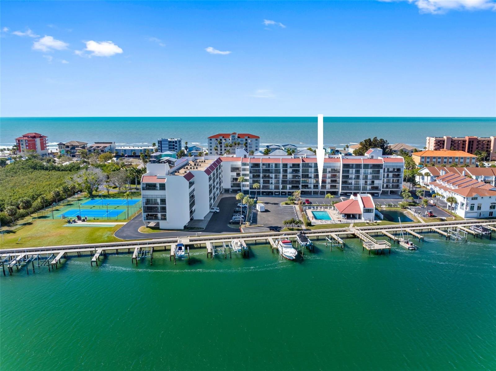 Lowest priced 2/2 Waterfront Condo along our Intracoastal.  Just 300 steps to the Beach.. Large 2/2 with 1260 Sq Ft.. Welcome to Vista Bay Condominiums on the intracoastal waterway in Indian Shores. The association just completed a complex makeover including a million dollar brand new, 530-foot waterfront promenade with all new docks, walkway plus a fishing and day dock. There are also waterfront tennis and pickle ball courts, grilling stations and a heated pool, perfect for enjoying Florida's aquatic lifestyle. Indulge in spotting dolphins, manatees, yearly boat parades and coastal family fun from the waterfront amenities. All assessments are paid. The second-floor, two-bedroom, two-bath, 1,260 square-foot condo offers direct water views from the living room from the 30-foot waterfront balcony, main bedroom and kitchen. There's also an 18-by-6-foot balcony off the spacious guest bedroom on the west side of the condominium. After two decades of being a family beach getaway, the current owner refreshed the unit with new paint, a new AC and water heater installed in 2026 and new carpets. The condominium conveys with an under-building parking, and second floor  storage space. Vista Bay is a well-managed complex that offers a heated pool, shuffleboard, car wash, grilling station, community fishing and sitting docks, deeded 30-foot to 40-foot boat slips, day dock and tennis and pickleball courts, plus an abundance of guest parking, ideal for entertaining or dinner guests. The beach access right across the street. Financials are in good shape and fully budgeted with $989 monthly maintenance fees. Indian Shores, also known as The Narrows, is known for its semi-private beaches due to coastal configuration and lack of public parking. The condo is near restaurants and nightlife, a small, friendly town just 8 miles south of Clearwater Beach, 22 miles due west of the Tampa airport and roughly three miles to the new Seminole City Shopping Center, an upscale mall destination offering shopping, cafes, restaurants, new movie theater, health store and gym. It is also approximately 20 minutes from the Dali Museum, Sports Arenas and downtown St Pete Museums. Vista Bay is a secured private complex with a three-month minimum rental period with three rentals per year, total. If someone rents only one week, it counts as one of the three rentals allowed. This is a private boating complex, hence the rare 40-plus guest parking spots. You will know your neighbor. Indian Shores has underground utilities for safety and aesthetics. The complex is near a police department, family friendly, bikeable and accessible. The beaches are never crowded here. Enjoy our coastal lifestyle. Call for immediate private showings.