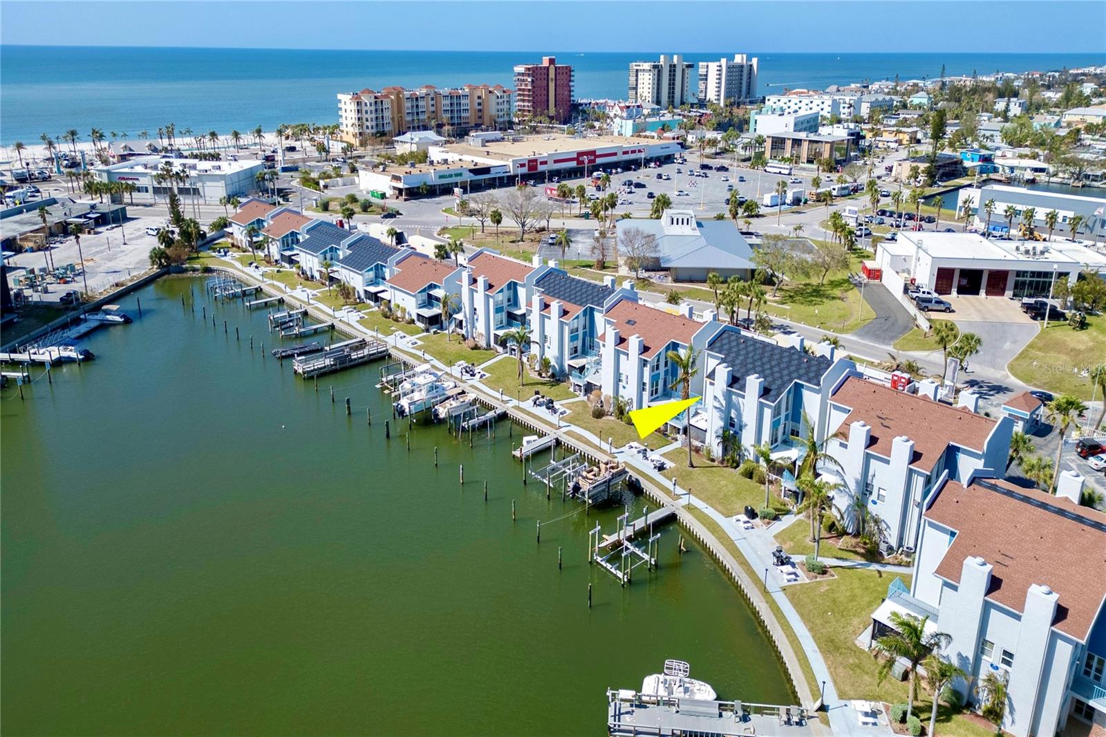 NEW PHOTOS ADDED!  Get your piece of paradise in gorgeous Madeira Beach with this waterfront condo IN PROCESS OF A MAJOR RENOVATION by the current owner.  THE DRYWALL IS IN PLACE AND THE FINISHING TOUCHES WILL BE COMPLETED SOON, SO PICK YOUR COLORS!  This ground level condo is steps away from the intracoastal waters for a scenic view every day!  Like other ground level condos in the area, which were flooded by a 100-year event of last year’s storms, this unit is currently under remediation on the interior to be "LIKE NEW" upon completion, so TAILOR IT TO YOUR OWN DESIGN STYLE AND TASTES FOR THE FINISHING TOUCHES!  This cozy, 1 bedroom, 1 bathroom, 430 square feet ground floor unit is situated on Boca Ciega Bay and a block away from the sugary sands of the Gulf of America.  THERE’S ALSO AN ADDITIONAL 210 SQUARE FEET IN THE FLORIDA ROOM NOT INCLUDED IN THE HEATED SQUARE FEET providing extra space with views of the water and marina, perfect for entertaining and relaxing to watch the sun set over the Gulf.  Enjoy coastal living in Madeira Beach Yacht Club, a gated waterfront community providing options for full-time living, a vacation home, or rental income with stays seven or more days.  Community amenities include 4 fishing piers, 2 pools, a billiard room, lounge, 2 exercise rooms, 2 steam rooms, spa, a business center, clubhouse, kitchen, library, and a game room.  All utilities are included in the monthly fee except for electricity.  Walk across the street to the public library, dog park, and R.O.C. park with a splash pad, soccer field, tennis and basketball courts, and a baseball diamond.  Hop on the Trolly to Johns Pass for dining and entertainment or drive across Tom Stuart Causeway to Seminole.  Boat slips are eligible for purchase by condo owners.  Don’s miss this opportunity to enjoy FLORIDA BEACH LIVING!  Owner financing available.