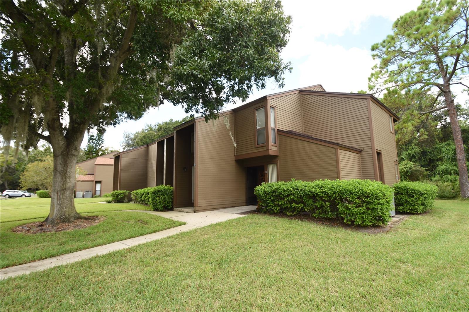 Welcome to this spacious second-floor unit offering comfort, convenience, and a relaxed, maintenance-free lifestyle. This well-designed 2-bedroom, 2-bath home features a primary bedroom, living room, and breakfast nook that all open onto a large screened-in back porch—perfect for enjoying the peaceful, quiet setting.

Located in the sought-after Woodhaven community, residents enjoy access to a variety of amenities including a sparkling pool, tennis courts, fitness center, and clubhouse—all just steps from your door. The HOA covers water, trash, and exterior pest control, adding to the hassle-free living experience.

Conveniently located near shopping, dining, and entertainment options, with easy access to major roadways. Whether you're looking for your next home or a great investment, this unit is a must-see!