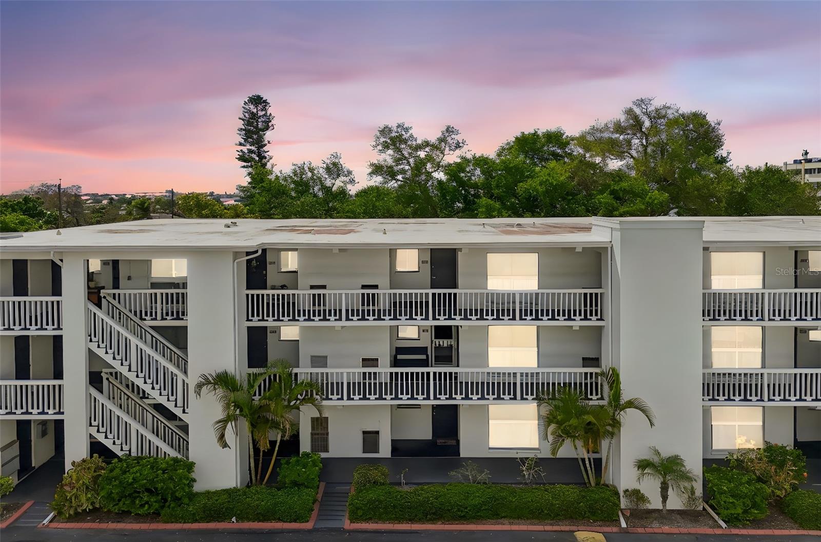 Welcome home to this charming, move-in ready condo ideally situated in the heart of Belleair Bluffs, one of Pinellas County’s most desirable coastal communities. Perfectly positioned just steps from the iconic Belleair Bridge Marina and public boat ramps, this all-ages first-floor residence offers an affordable opportunity to enjoy the Florida lifestyle surrounded by water, sunshine, and everyday convenience. Whether you’re heading out for a sunset cruise, grabbing brunch at a local favorite, or spending the day at the nearby award-winning Gulf beaches, this location truly makes everyday feel like a vacation.

As you arrive, you’ll appreciate the convenience of your own covered carport just steps from the front door. Inside, this well-maintained 2 bedroom, 2 bathroom condo offers a comfortable and functional layout designed for easy living. The kitchen has everything you need with stainless steel appliances, excluding the refrigerator, along with a large pantry that provides excellent additional storage. The living and dining room combination feels bright and inviting, featuring wood-look tile flooring and a seamless flow into the sun-lit enclosed patio, creating the perfect space to relax, unwind, or enjoy your morning coffee.

The split bedroom layout offers both comfort and privacy, with luxury vinyl plank flooring in both bedrooms for a clean and updated feel. The oversized primary suite features dual closets and its own ensuite bathroom, while the guest bedroom is conveniently located near the second full bathroom, ideal for visitors or everyday use. Step outside to the enclosed sunroom where you’ll also find a private storage closet, adding even more practical functionality to the space.

This well-kept community offers an elevator, common laundry room, beautifully landscaped courtyard views shaded by mature oak trees, and a low-maintenance lifestyle that is hard to beat. Association fees include water, sewer, trash, grounds maintenance, building maintenance, roof, basic cable TV, and insurance on the building, giving you peace of mind and easy ownership. With no flood insurance required, a pet-friendly policy allowing two cats, and a 3-month minimum rental policy, this property is an excellent option for a full-time residence, seasonal getaway, or investment opportunity. Don’t miss your chance to own your own slice of paradise in Belleair Bluffs.