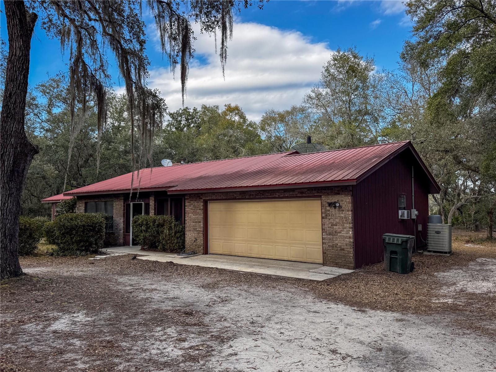Welcome to this spacious 3-bedroom, 2-bath lakeview home on Mandarin Lake in the heart of Melrose. Tucked among mature trees in a peaceful rural setting, this property offers the perfect blend of privacy and comfort. Inside, you'll find bright, airy living spaces including formal living and dining rooms, a cozy fireplace, and a sunroom filled with natural light and stunning water views. The primary suite features a private bath, while a bonus room with plumbing and A/C provides flexibility for an office, hobby space, or workshop. Enjoy a 2-car garage and ample outdoor space for all your hobbies and entertaining. If you're looking for tranquil lake living without sacrificing convenience, this is it.