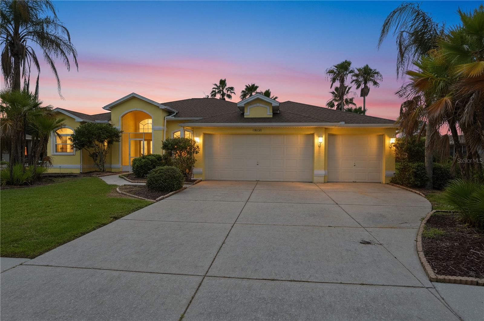 Welcome to 18131 Rivard Blvd in Brooksville, Florida--a beautiful 3-bedroom, 2-bath home with a 3-car garage situated on a spacious homesite overlooking a serene pond in the desirable Trails at Rivard golf course community. Enjoy all the benefits of golf course living without golf balls in your backyard, as this property offers peaceful water views and added privacy instead of direct golf course frontage. Designed with an open-concept floor plan, this home features a spacious living area that seamlessly connects to the kitchen and dining spaces, making it ideal for both everyday living and entertaining. Large windows and sliding glass doors provide abundant natural light while showcasing the tranquil pond views. Step outside to your private backyard retreat featuring a sparkling pool, perfect for enjoying Florida's year-round sunshine. The oversized lot offers plenty of room for outdoor activities, gardening, or simply relaxing while taking in the scenic waterfront setting. Located within the sought-after Trails at Rivard community, residents enjoy a golf course lifestyle with convenient access to shopping, dining, medical facilities, and major roadways. This exceptional property combines space, comfort, and stunning water views in one of Brooksville's most desirable neighborhoods. Schedule your private showing today and experience Florida living at its finest.