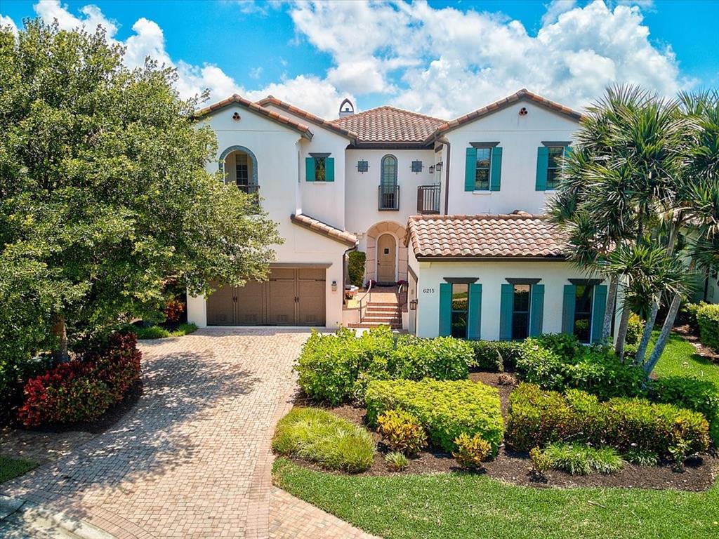 Former Arthur Rutenberg “Terracina” Model.  This multi-award winning home sits on a lakefront homesite in Legends Bay.  Spanish revival-style architecture with a layout that makes the most of the views, both inside and out. Numerous outdoor spaces, including a front courtyard, two story screened lanai, multiple balconies and cabana add to the indoor/outdoor lifestyle found in this special home.  As a former model home, you cannot help but notice that everything in the home has been thoughtfully selected.  Highlights include the chef's gourmet kitchen, with top of the line appliances including a glass front Sub-Zero refrigerator & Wolf dual gas professional range with 5 burner cooktop, griddle and dual ovens. Other features include the 2nd floor bonus room with wet bar, powder room, sunken TV area and access to the 2nd floor balcony with fireplace.  Impact windows, a formal study, heated pool, spa, outdoor kitchen & bath, soaring ceilings, hand-scraped "heritage hickory" flooring, 2 fireplaces (one dual & one on 2nd floor balcony), elevator, wet bar, wine storage, multiple niches and built-ins.  A masterpiece of quality and design. Far too many extras to mention here; feature sheet, floor plan and survey available.  Legends Bay is a private gated community nestled along Sarasota Bay.  Just a short bike ride to world-renowned sport training mega site IMG Academy, as well as IMG Golf & Country Club & Bradenton Tennis Academy.  Less than 7 miles to Anna Maria Island and its gorgeous beaches, fine & casual dining and plenty of shopping. Short drive to downtown Bradenton, Riverwalk, St. Armand's Circle, Sarasota and SRQ International Airport. An ideal location, a highly sought after community, and a dream home makes this the right move!  3 brand new Trane A/C units installed July 2022. Room Feature: Linen Closet In Bath (Primary Bedroom).