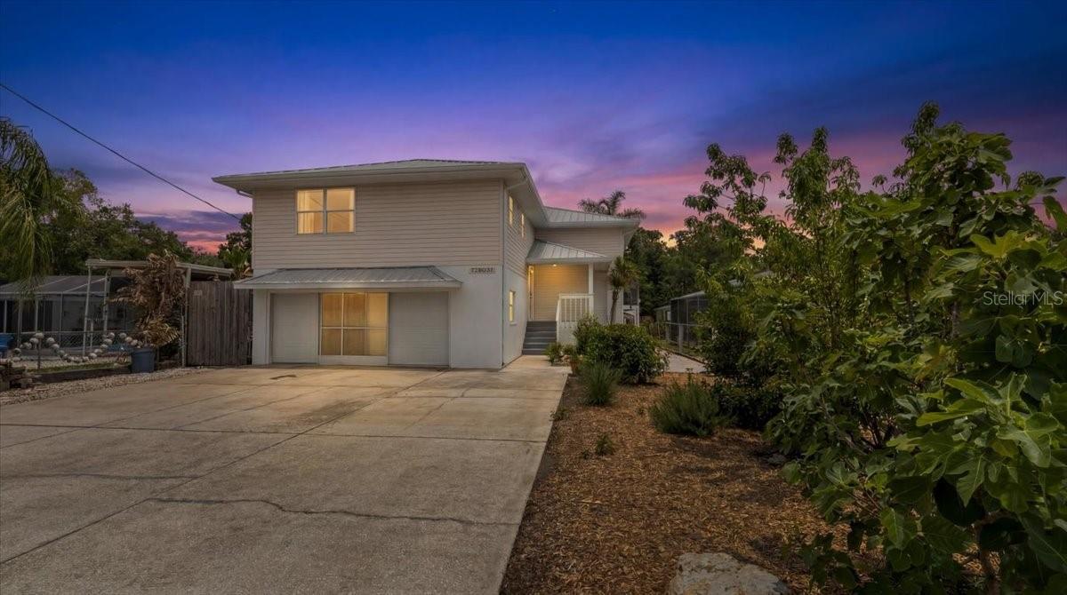 Welcome to your own WEEKI WACHEE RIVER RETREAT OASIS! This beautifully maintained ELEVATED WATERFRONT HOME offers direct access to the crystal-clear, spring-fed waters of the famous Weeki Wachee River through a scenic canal setting. Designed for the ultimate Florida lifestyle, this property is perfect for boating, kayaking, paddleboarding, fishing, entertaining, or simply relaxing in your private tropical retreat. SHORT-TERM RENTALS ARE ALLOWED, making this an incredible opportunity for full-time living, a vacation getaway, or investment property. This spacious home features 2 BEDROOMS, 3 FULL BATHROOMS, and an OVERSIZED 3-CAR GARAGE with additional storage and built-in shelving perfect for a workshop or hobby area. There is also a beautifully updated STUDIO APARTMENT / IN-LAW SUITE located downstairs with its own kitchen area, living space, and full bath--ideal for guests, extended family, or rental income potential. Two mini split systems help efficiently cool the garage and studio apartment area. Step inside to an OPEN, LIGHT & BRIGHT GREAT ROOM FLOOR PLAN showcasing VAULTED CEILINGS, a large picture window, and beautiful LUXURY VINYL FLOORING throughout. French doors open to the expansive SCREENED-IN SECOND FLOOR PORCH overlooking the peaceful canal waters, creating seamless indoor-outdoor living. The spacious kitchen is open to the family room and dining area and features a convenient BREAKFAST BAR, pantry, and nearby laundry room. The generously sized primary suite offers comfort and privacy, while the beautifully updated primary bath features CUSTOM CABINETRY, solid surface countertops, a stunning FLOOR-TO-CEILING CUSTOM TILE SHOWER, and built-in shelving. The guest bath has also been tastefully updated with custom cabinetry, solid surface counters, and a tub/shower combination. Outdoor living is where this property truly shines! Enjoy an amazing backyard oasis complete with a WET BOAT HOUSE, outdoor kitchen area, screened entertaining space, low-maintenance XERISCAPE LANDSCAPING, imitation grass areas, and extensive wood decking leading to the water. Stairs built directly into the canal provide easy water access, and you can fish right from your deck. Bring all your water toys--there is plenty of room for boats, kayaks, jet skis, RV parking, and more thanks to the EXTRA-WIDE DRIVEWAY and oversized parking areas. Additional features include a METAL ROOF, SCREENED LANAI spanning the back of the home, front porch, abundant storage closets, and even potential space for a future elevator shaft. Located in the heart of the Nature Coast, this exceptional property offers easy access to local restaurants, marinas, entertainment, Weeki Wachee Springs State Park, and the Gulf of Mexico. Experience true Florida waterfront living at its finest!