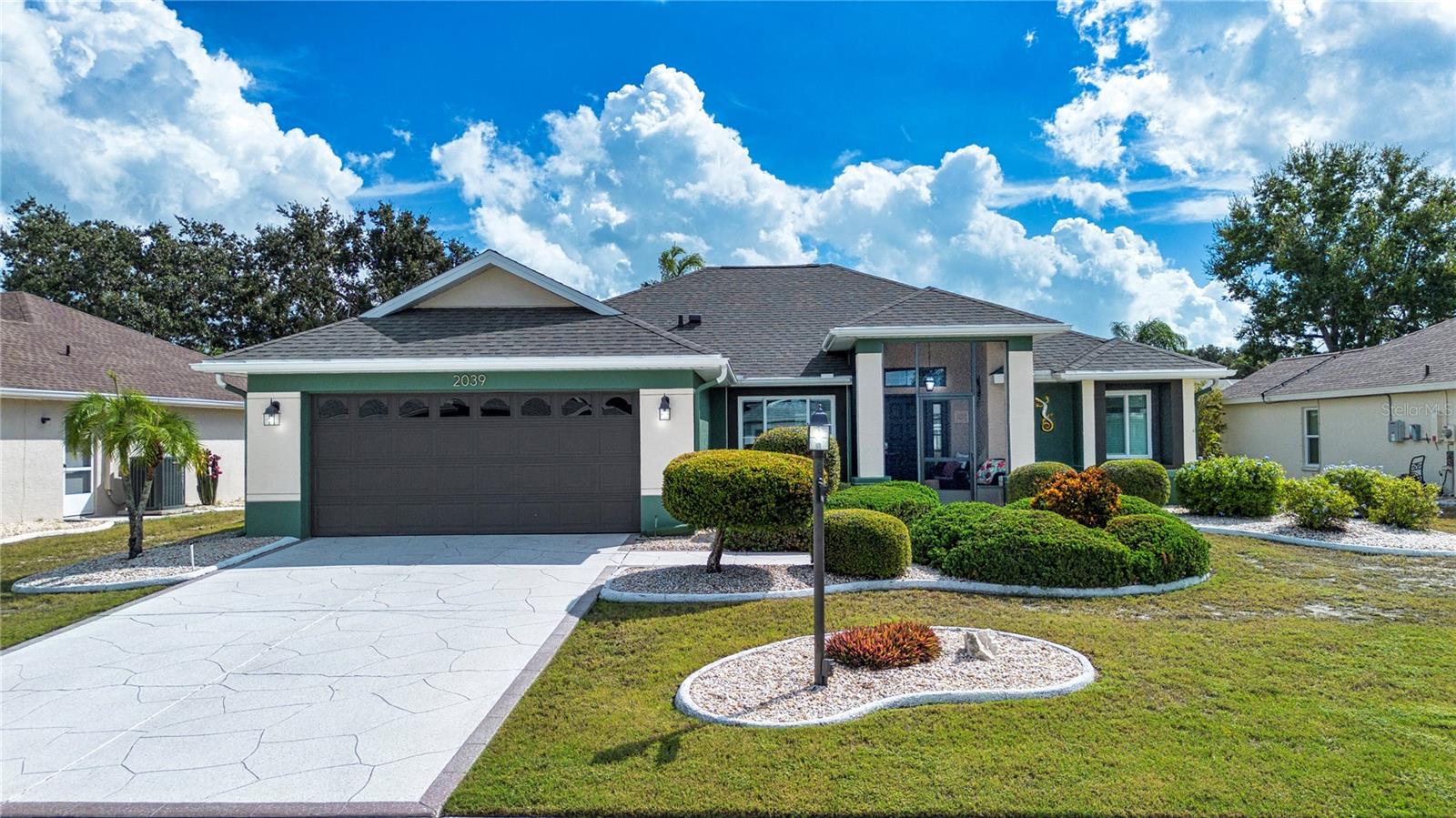 Welcome to this strikingly upgraded and move-in ready home located in a quiet neighborhood of the 55+ retirement community of Sun City Center, FL that was recently declared the best retirement community in the United States.  As you arrive at the home, the care and pride of ownership is evident.  You are greeted with manicured landscaping, a freshly painted exterior and custom painted driveway and walkway that leads to the screened-in front porch entry that features new aluminum framing and screening.  Upon entering the home, you will find new laminate flooring throughout the entire house except for the bathrooms.  The interior has been repainted, and all the ceiling popcorn has been removed, the drywall seams were retaped and then a knock-down texture was applied and painted.  The volume ceilings, contemporary features, diagonally laid flooring, new lighting and fan add to the openness of this stunning living room.  The totally upgraded eat-in kitchen is a cook’s dream. It includes new kitchen cabinets, quartz counter tops and tiled backsplash.  New stainless-steel appliances include a GE refrigerator and glass top stove with an air fryer oven, a Bosch dishwasher and a built-in Panasonic microwave.  There is a convenient counter to sit at for a quick meal or conversation with the cook, along with an airy breakfast nook in the bay window area. 
For more casual dining get-togethers, the adjacent dining room features double glass barn doors. The enclosed back porch can also be accessed from the kitchen as well as the living room making this home perfect for entertaining friends and family.  This home also features a split floor plan which provides for convenience and privacy when entertaining family or guests.  The Primary suite has ample space for king size furniture, and the bathroom has new LVT flooring, light fixtures and a refinished soaking tub.  The guest bedroom and bath are actually an ensuite bedroom.  A new door was constructed to give additional privacy to overnight guests.  The bathroom also has been upgraded with new LVT flooring, new vanity and walk-in shower along with new mirror and lighting.  Another huge plus for this house is everything that has been done to minimize insurance cost and maximize comfort.  All electric and plumbing is up to required 4-Point Inspection requirements. A new roof was installed in 2025 that includes a peal and stick substrate and 4 nails in the hurricane straps. New facia, soffit, and gutters were also added.  A new Carrier HVAC system was installed in 2024 and Pella Fortress Storm Defense hurricane windows were installed in 2023.  The water heater is also new and additional attic insulation was added to meet current building codes. The complete list of improvements and upgrades is more than can be listed here.  The best thing to do is to call to make an appointment to see this home before it’s too late.