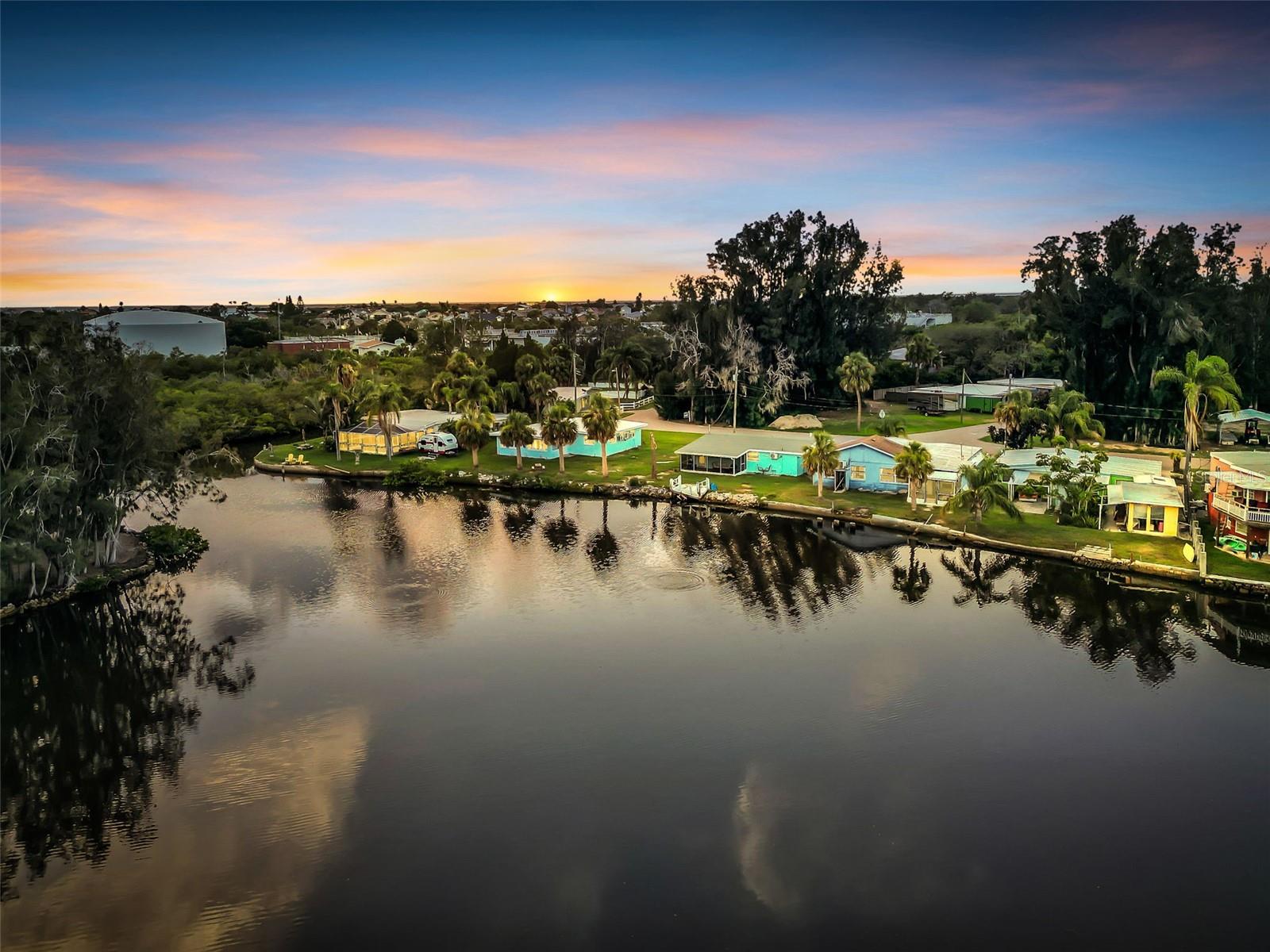 Also listed as residential MLS#TB8447875  WATERFRONT PARADISE! RARE OPPORTUNITY! GULF ACCESS! 2.3 PRIVATE ACRES! YOUR OWN BOAT RAMP! RV PARKING/HOOK UP! LARGE GARAGE AND LARGE DETACHED BUILDING! DEAD END STREET! NO HOA! There is an Elevated home WITH POOL on 2.3 PRIVATE ACRES WITH GULF ACCESS – Just 1.5 Miles from Downtown New Port Richey! Don’t miss this rare opportunity to own a stunning, waterfront retreat situated on 2.3 acres with 240 FEET OF DIRECT FRONTAGE on Cross Bayou, offering easy access to the Gulf of Mexico! This expansive, private estate setting delivers the ultimate Florida lifestyle—golf cart friendly and ready for entertaining, relaxing, and exploring the water.  The property is equipped with water, a dedicated drain, and a 220V outlet, making it RV-ready and perfect for convenient parking and hookup. The massive pole barn offers plenty of versatile space—perfect for storing extra vehicles, boats, recreational gear, or even setting up a workshop or greenhouse. The expansive lot still leaves ample room for future additions like a pickleball court, putting green, or anything else you envision. Close proximity to downtown New Port Richey,  Enjoy the perfect mix of privacy and convenience. Whether you're looking for a primary residence, vacation home, or smart investment, this property truly has it all. Schedule your private tour today—homes like this are rarely available!