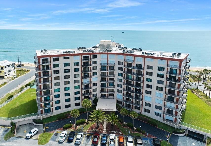 One or more photo(s) was virtually altered. Experience coastal living at Ocean View Manor Condominiums, perfectly situated between the Atlantic Ocean and Ocean Palm Golf Club. Priced to sell, this newly renovated condominium features three private balconies with breathtaking sunrises, spectacular sunsets, and refreshing ocean breezes. The spacious floor plan offers three private bedroom suites, each with its own full bathroom and ample closet space, providing exceptional comfort and privacy for family and guests. Category 5 Turtle impact glass windows provide outstanding storm protection and peace of mind. Residents enjoy resort-style amenities including a swimming pool, fitness center, and tennis/pickleball courts. Just minutes from the Flagler Beach Pier, waterfront dining, local shopping, and miles of beautiful beaches, with historic St. Augustine and Daytona Beach just a short drive away. Whether you're seeking a primary residence, vacation retreat, or investment opportunity, this exceptional coastal property has it all.