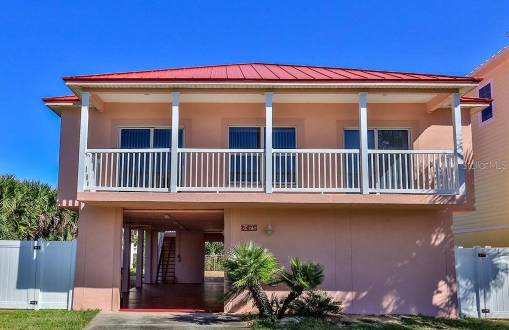 Welcome to the Red Roof Beach Cottage! Enjoy unobstructed ocean views from this beautiful beach side home! Walking distance to the ocean and the National Seashore Park or go to JB's Fish Camp for kayaking and boat launch. Beautiful sunrises and sunsets. Includes all the amenities to make you feel like your home. Complimentary wifi, washer and dryer, and cable TV. The home has 3 bedrooms and 2 baths with two balconies, an ocean view kitchen with breakfast bar and living area.  2 bedrooms have  King sized beds with TV and entrance to the  the ocean view balcony. The 3rd bedroom has a twin bed with trundle. Extra sheets, blankets and towels will be available for your use. Tenants will have access to the upstairs home. The backyard is a common area shared between the upstairs home and downstairs studio. NO PETS. ;CleaningFee: 200