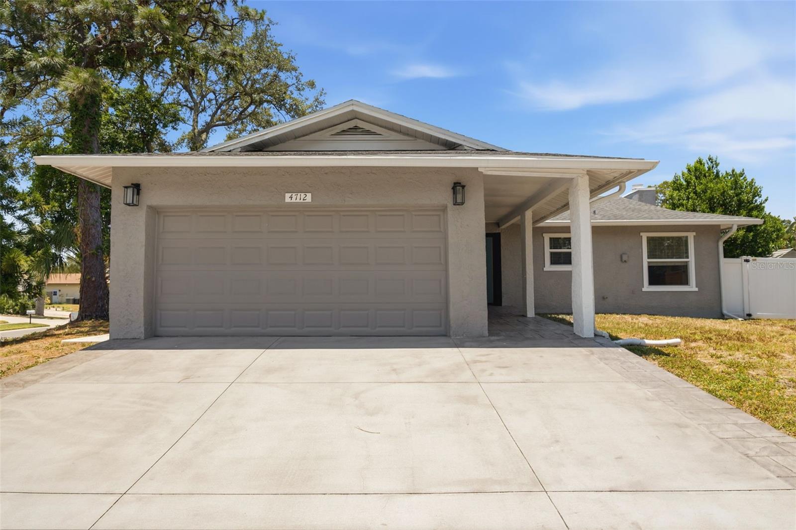 This incredible move-in-ready home in highly desirable Palm Harbor comes with a $6,000 seller credit at closing! Located just minutes from the Gulf beaches in a desirable non-flood zone, this beautifully maintained home offers the perfect blend of peace of mind, comfort, and convenience. Ideal as a first home, seasonal retreat, or for those looking to downsize, the community also features an optional HOA of only $100 annually.

The spacious floor plan features a large primary bedroom, engineered hardwood flooring throughout the living areas, elegant crown molding, and an oversized screened lanai with an expanded deck—perfect for entertaining or simply relaxing. The kitchen boasts high-quality granite countertops, subway tile backsplash, stainless steel appliances, and quality cabinetry that extends into the bathrooms and laundry room. The primary suite also features a custom closet organizer.

Major Updates: Roof (2017) • High-Impact Windows (2018) • Expanded Deck & Birdcage (2021) • A/C (2023).

Additional improvements include blown-in insulation above and throughout, new return ductwork replacing the original returns, attic ventilation fans with wireless controls for improved energy efficiency, an expanded driveway with additional parking pad, vinyl fencing with gate, and the home comes wired with ADT security.

Location truly sets this home apart! Just steps from the Pinellas Trail, you'll enjoy approximately 45 miles of scenic trails for walking, running, and biking. You're also just minutes from Sunset Beach, Fred Howard Park, the historic Tarpon Springs Sponge Docks, Honeymoon Island State Park, charming Dunedin, and convenient access to U.S. Route 19 for commuting throughout Pinellas County.  

This exceptional home truly offers the complete package—quality updates, energy-efficient improvements, an outstanding location, and move-in-ready condition. Schedule your private showing today!