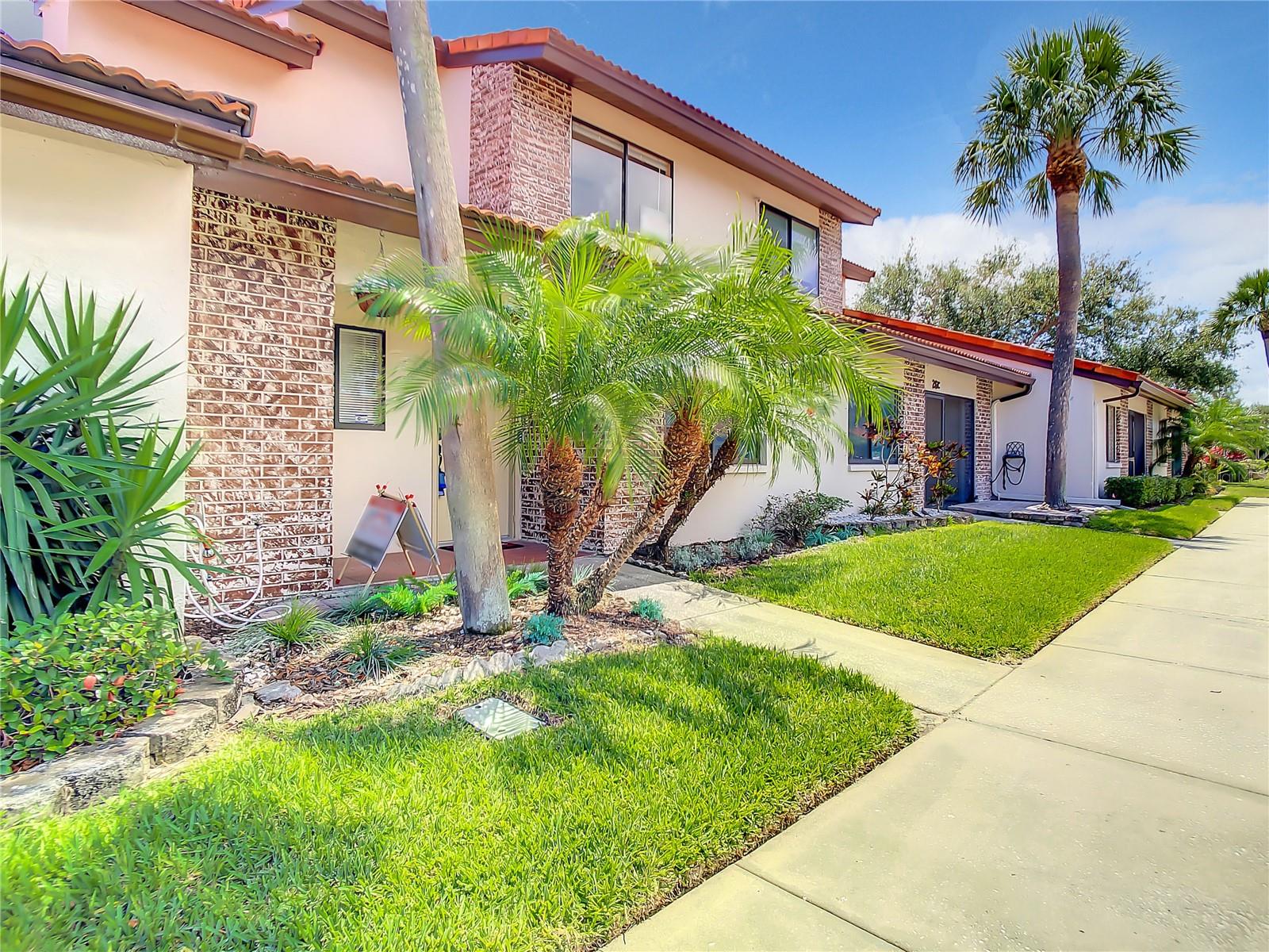 Owner is ready to sale. Bring all written offers. Seller can assit with closing cost etc. 
Bring your pets.  Association has no weight limit on dogs.  Community pool is heated. Enjoy charming 3 bed 2 bath WITH additional heated and cooled space can be easily used as a FOURTH bedroom. Very unique living experience for a condo. Property has a front porch another area which is closed in and a covered patio which has a live, natural canopy covered lanai and hot tub electric hook up in place. Kitchen is inviting with room for family and friends.  Kitchen is separated by a partition wall ideal for tv and digital equipment. Two bedrooms are located upstairs with a bathroom and 3rd bedroom is on the 1st floor with another full bath. Living/family room is spacious and has room for larger couches. There is also Air conditioned glass enclosed Florida room with storage easily use a fourth bedroom. Bring your furniture and make this home.