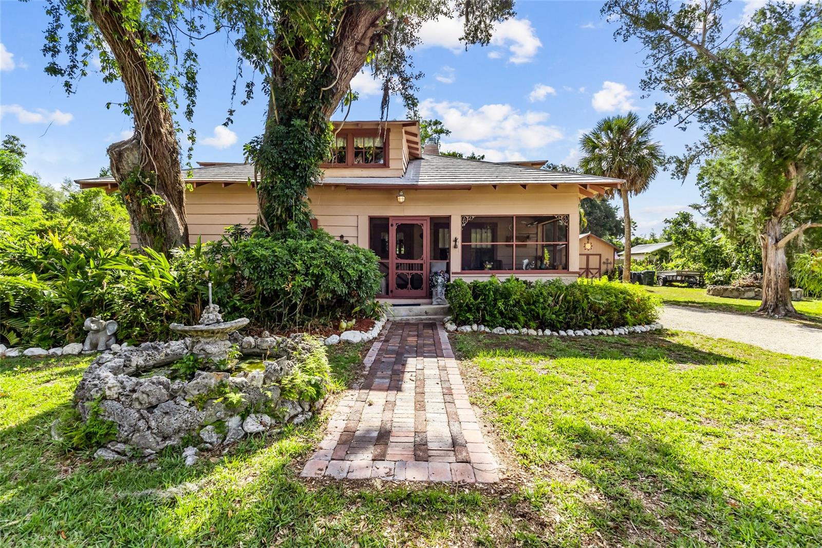 Step into Sarasota charm with this 1930s character-filled home, where vintage appeal meets everyday flexibility...and no HOA restrictions. This unique 3-bedroom, 3-bath property offers the freedom to truly live your lifestyle: bring your boat, RV, and all your toys with plenty of space to park and play.
As you enter, you're welcomed by a screened front porch, leading into a warm and inviting living room featuring a centerpiece fireplace and stunning exposed wood beams. The flexible floor plan includes two bedrooms, a bath, and a loft area upstairs, giving you the option to choose your primary suite on either the first or second floor.
The kitchen opens to a backyard deck where a blooming jasmine canopy creates a beautiful setting for morning sunrises. The partially fenced yard offers ample space to create your own private retreat, complete with a garden area, fire pit for cozy evenings, and an additional shed for storage, hobbies, or a workshop.
Tucked away on a quiet street, this home feels like a peaceful escape while being just minutes from downtown Sarasota, world-class beaches, and with easy access to I-75.
Blending timeless 1930s character with functional living space, this home offers flexibility for guests, multi-generational living, or even rental potential. If you’ve been searching for a property with personality, space, and freedom—this is it.