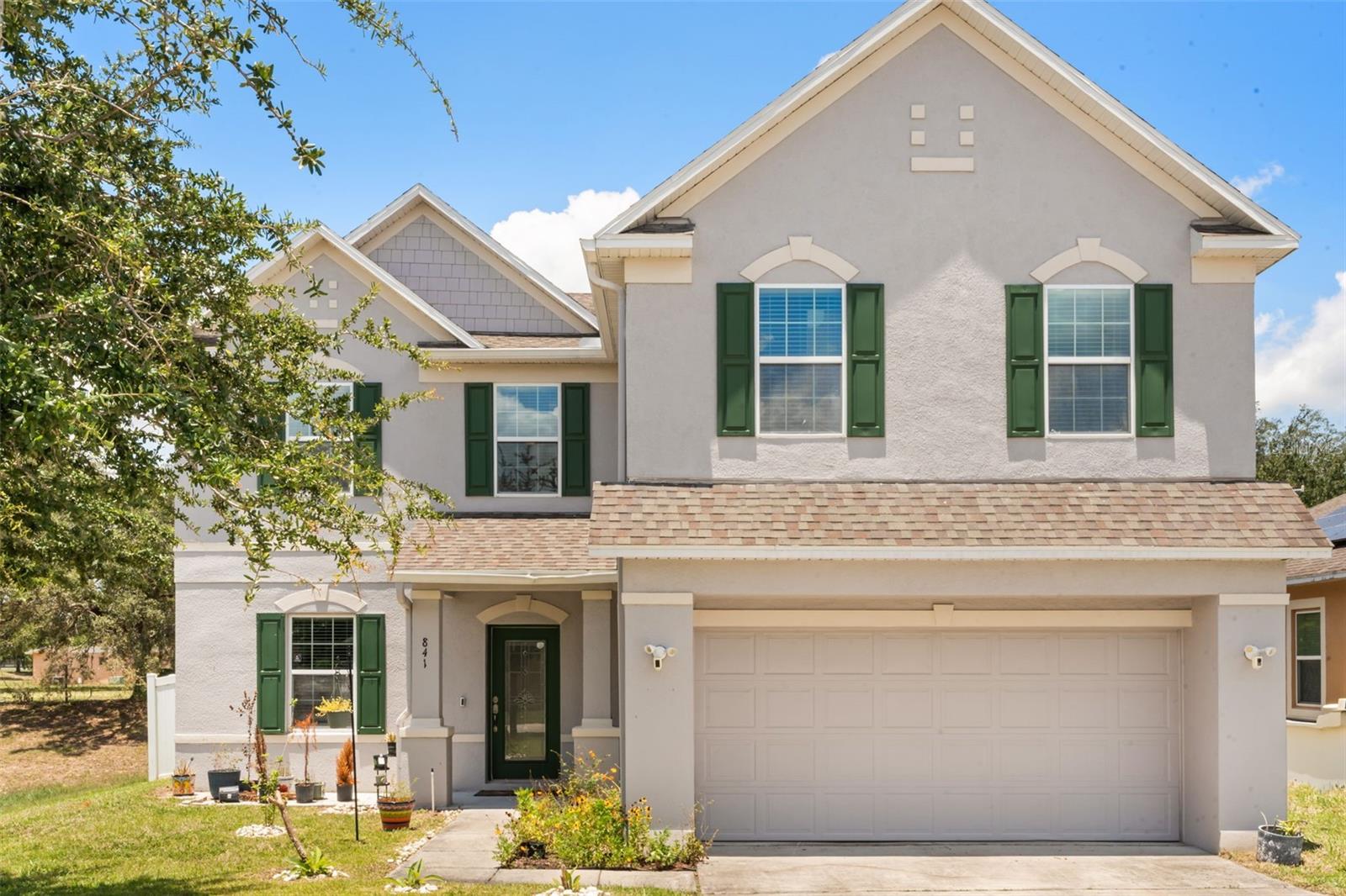 Welcome to 841 Jefferson Boulevard in Haines City, where space, flexibility, and energy efficiency come together. Built in 2016, this thoughtfully designed two story home offers 5 generously sized bedrooms, 3 full bathrooms, over 3,000 square feet of living space, a 2 car garage, and fully paid off solar panels, allowing you to enjoy the benefits of solar with no monthly solar payment. A standout feature of the floor plan is the first floor bedroom and full bathroom, making it ideal for guests, multigenerational living, or a private home office. Designed for both everyday living and entertaining, the open concept layout centers around a spacious kitchen with a large center island, abundant cabinetry, generous countertop space, and plenty of room to cook, gather, and stay connected with family and guests. The kitchen flows seamlessly into the dining and living areas, creating a welcoming space for everything from busy mornings to holiday celebrations. Upstairs, the oversized loft provides additional living space that can easily serve as a media room, game room, playroom, home gym, or second family room. The spacious primary suite offers a private retreat with a walk in closet and en suite bathroom, while the remaining bedrooms continue the home’s generous proportions, providing comfortable space for family, guests, or working from home. Step outside to a fully fenced backyard designed for both privacy and enjoyment. Whether you’re relaxing on the weekend, entertaining friends, or watching little ones or pets play, the outdoor space offers room to make it your own. Mature fruit trees add charm and the opportunity to enjoy fresh fruit right from your backyard. Conveniently located near US 27, I 4, shopping, dining, schools, and everyday conveniences, this home combines generous living space, a versatile layout, energy savings, and outdoor enjoyment in one exceptional package.