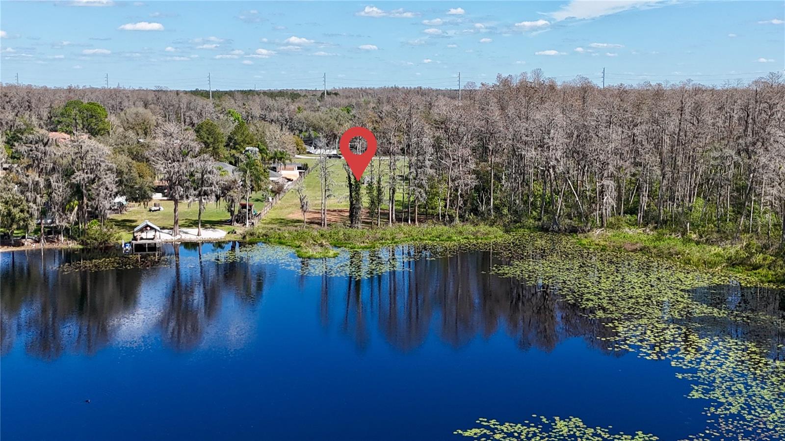 Price reduction - VACANT LAND ON THE LAKE, READY TO BUILD YOUR DREAM HOME on Lake Virginia in Lutz—this is the kind of lakefront opportunity that almost never comes to market. Tucked at the end of Blount Road on a quiet dead-end street, this .86-acre upland homesite (with approximately 6 acres of wetlands for natural privacy) offers a truly rare combination: private, spring-fed waterfront, no flood zone, no HOA, and no CDD—all in an A-rated school district near the coveted Cheval area with quick access to Dale Mabry, the Veterans Expressway, shopping, dining, and airports.  This is not just a homesite—it’s a rare, luxury lakefront estate canvas in one of Lutz’s most exclusive waterfront pockets. The only available lakefront lot in the area, paired with a world-class builder and a showpiece plan—offering the perfect blend of privacy, prestige, and convenience.
Located in desirable Lutz, Blount Road offers a peaceful residential setting with convenient access to Tampa, Wesley Chapel, Land O’ Lakes, Lake Magdalene, and Carrollwood, along with nearby shopping and dining at Tampa Premium Outlets, The Shops at Wiregrass, The Grove at Wesley Chapel, and International Plaza. Enjoy easy access to I-275, I-75, Veterans Expressway, Tampa International Airport, Downtown Tampa, St. Petersburg, Clearwater Beach, Honeymoon Island, Gulf Coast beaches, golf, parks, lakes, and year-round Tampa Bay entertainment.