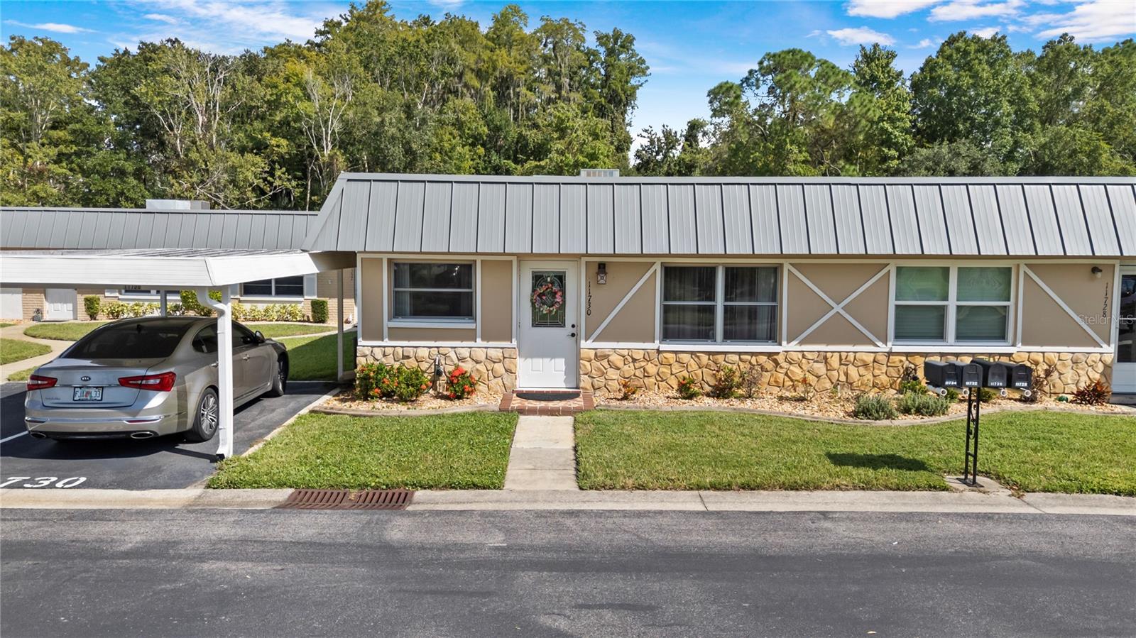 Gated ACTIVE 55+ PET friendly community Paradise Pointe in Summertree has impeccably maintained lush landscaping, clubhouse and recreation center including an optional public 9 hole golf course. This 2 bedroom 2 bath condominium has its own assigned covered carport directly in front of the entrance into the condo. The Florida Room/ Lanai overlooks the stream and CONSERVATION with NO REAR NEIGHBORS and has an INSIDE LAUNDRY closet with a washer and dryer included. The HOA maintains the roof and in 2013 roof was replaced by the HOA. Spacious floorplan with LAMINATE and TILE flooring throughout. Recent updates include NEW WATER HEATER & NEW ELECTRICAL PANEL replaced in 2023. Resort style living at Pointe West in Summertree with Fitness Center, Heated Pool & Spa, Billiard Room, Tennis, Bacci and Shuffleboard, Game Room, Lounge, Library, Laundry Facilities and more. Enjoy the native animals and the park like butterfly garden directly in front of this condo with backyard privacy on the conservation.  Condo fee includes grounds and building maintenance (including roof), cable (including Disney+, HBO Max, Peacock, Paramount+, DVR), internet, trash pickup, and outside pest control. Soil remediation completed in 2012. All documents are available and the condo is insurable. Room sizes are approximate. Buyer to verify all information.