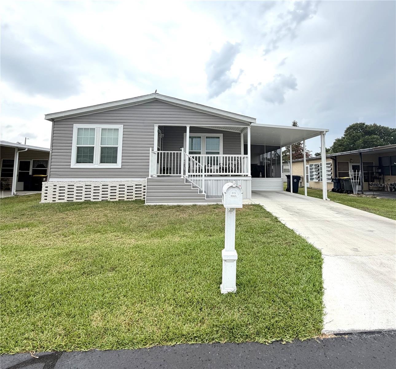Welcome to easy, carefree living in the sought-after 55+ community of Marianna Park! This like-new 2024 home offers the perfect blend of comfort, style, and low-maintenance living—with the added bonus of owning your own land and enjoying a low HOA. Step inside to an open-concept layout featuring a spacious living room filled with natural light and a bright, inviting kitchen designed for both everyday living and entertaining. The home showcases luxury vinyl flooring throughout—no carpet—along with upgraded fixtures, an enhanced stove and refrigerator, thoughtful details like chair rail accents add an extra touch of charm, and an extra-large water heater for added convenience.
The primary suite is a true retreat, complete with a large walk-in closet, dual sinks, a relaxing garden soaking tub, and a separate walk-in shower. 
Enjoy Florida living at its best with a welcoming front porch and a screened side porch—perfect for morning coffee or evening relaxation. Additional features include a carport and a storage shed for all your extras.
Marianna Park offers an active lifestyle with a clubhouse featuring regular activities like bingo, cards, and shuffleboard, plus a pool table for social gatherings. Outdoor enthusiasts will love the lake access, fishing dock, boat ramp, and secure storage for boats or RVs. Golf carts are welcome, making it easy to enjoy the community.
Ideally located between Lakeland and Winter Haven, this home puts you close to shopping, dining, boating and fishing and everything Central Florida.