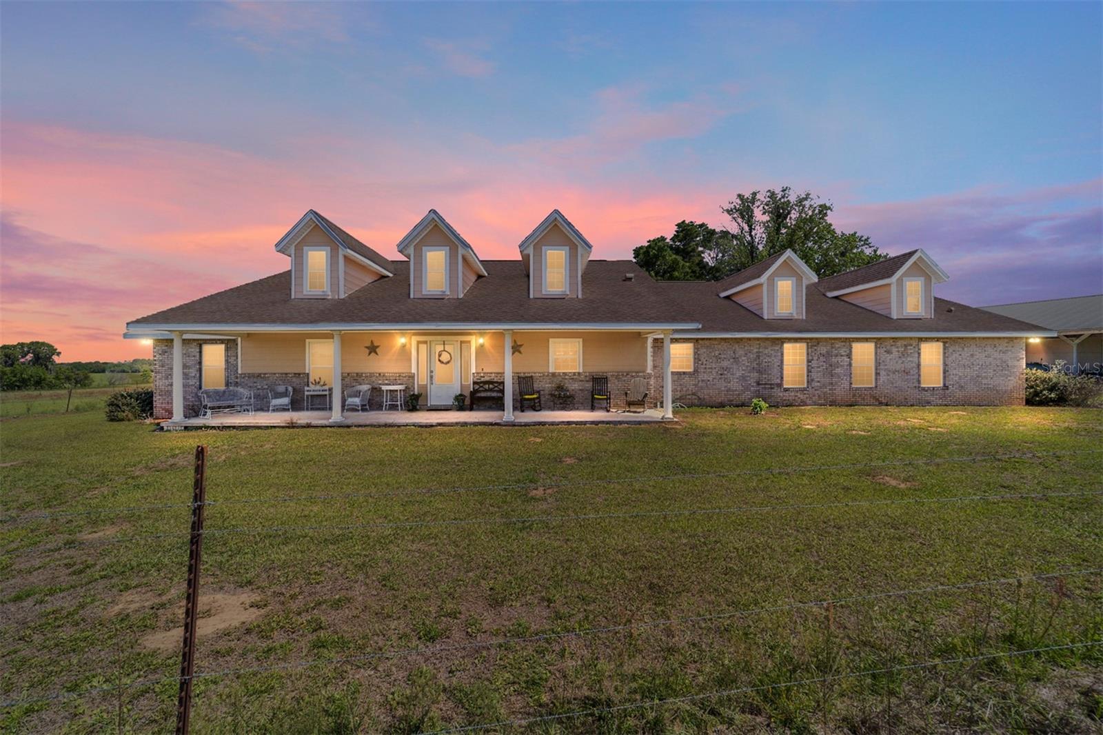 One or more photo(s) has been virtually staged. 159.25-acre farm and ranch property near the World Equestrian Center, offering exceptional land potential for agriculture, livestock, or equestrian use.

The property features cross-fenced pastures for efficient management, a cattle corral across the rear 120 acres, and ample open space to develop barns, paddocks, or a riding arena. A large workshop and pole barn provide functional storage and equipment space.

A 4-bedroom, 3-bath ranch-style home provides comfortable living with an open-concept layout, spacious master suite, and inviting front and back porches overlooking the surrounding pasture.

With expansive, usable acreage and flexible layout, this property is well-suited for a working farm, horse facility, or private rural estate—all within convenient reach of Ocala’s equestrian hub.