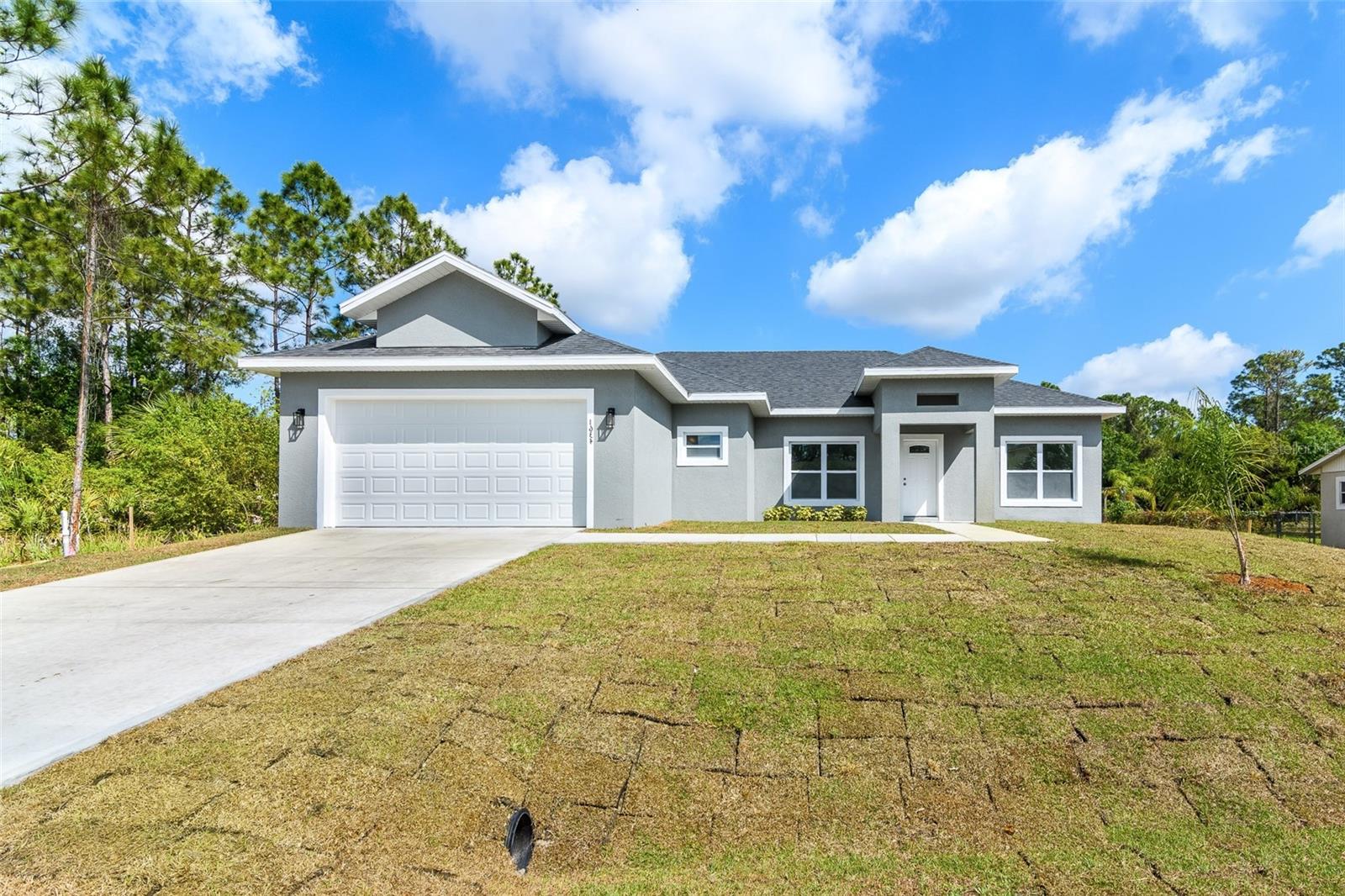 Ready NOW! A brand new fence to be installed after closing! Enjoy low insurance w/ HURRICANE IMPACT windows! Luxury vinyl flows throughout the home creating a modern fusion of comfort & class including all bdrms. Natural light bounces into a spacious living rm gracefully flowing into the roomy casual dining, & large kitchen w/ample storage & beautiful cabinets w/ soft close doors & drawers accented by the sleek quartz counters, stylish backsplash, huge center island w/ light pendants & all stainless steel appliances. The sizable master suite is marked w/ granite counters, double sinks, a tiled shower & a large walk-in closet. The ensuite is perfect for guests or in-laws. Outside, enjoy al fresco celebrations in the large trussed porch & backyard! Within 2 Min to Bayside Lakes & Bayside High!