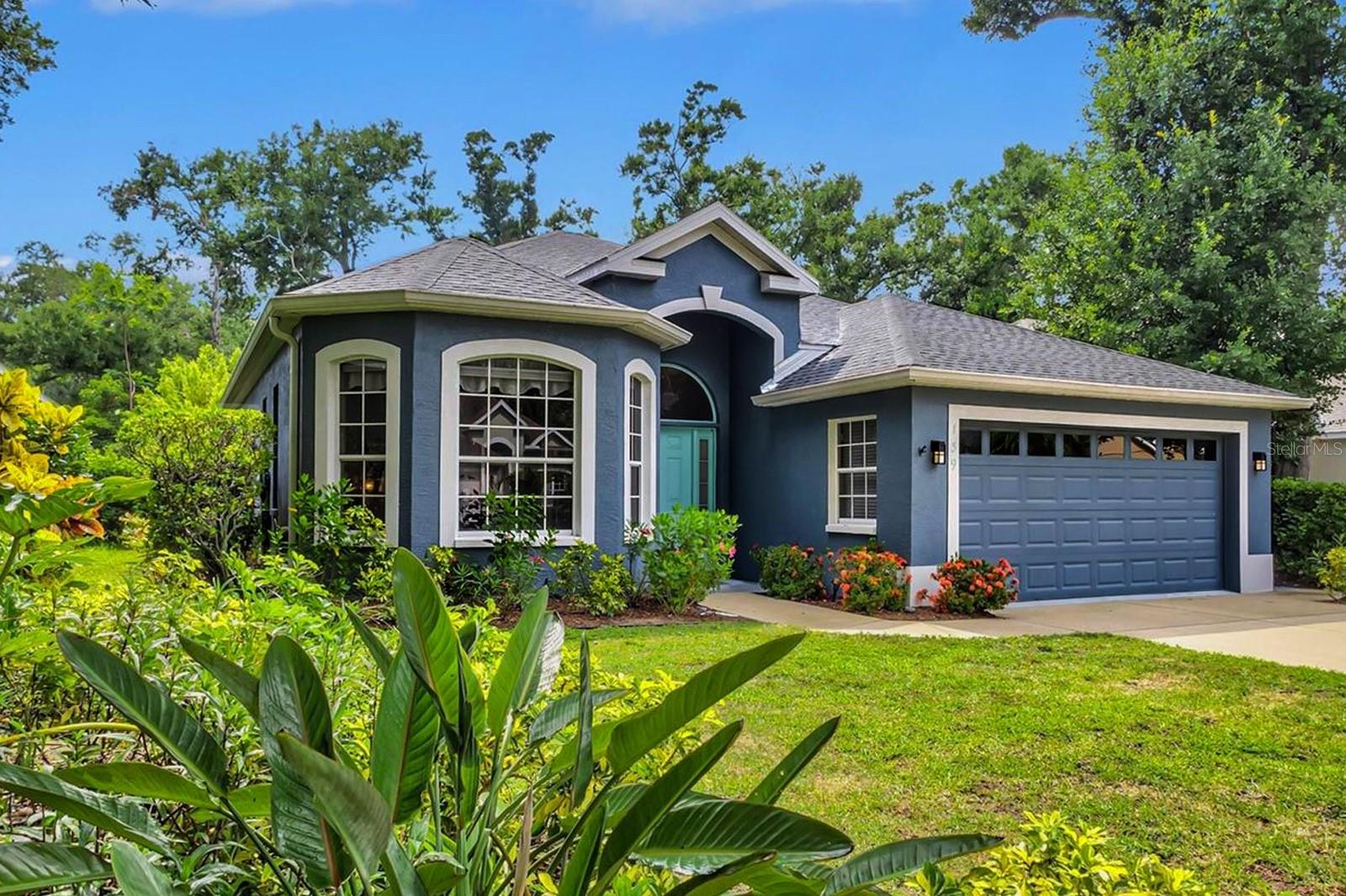 Behind the gates of Oak Court, this beautifully appointed three-bedroom, two-bath residence offers a rare combination of thoughtful design, quality craftsmanship, and modern convenience. Situated on a .17-acre homesite, the home enjoys a peaceful setting surrounded by mature trees and quiet streets, while remaining just minutes from downtown Sarasota, St. Armands Circle, and Sarasota's renowned Gulf beaches. Inside, soaring ceilings and porcelain plank flooring extending throughout the home create an open, light-filled atmosphere. Over $250,000 in carefully selected improvements and custom finishes have transformed the residence into a home of exceptional comfort and style. While custom remote-controlled shades and window treatments provide effortless privacy and ambiance. At the heart of the home is a stunning kitchen designed to balance beauty and functionality. An oversized quartz island serves as the centerpiece, surrounded by floor to ceiling custom cabinetry, designer hardware, and a striking glass, marble, and diamond-chip backsplash. The fully integrated smart appliance package includes a touch-control cooktop, double wall ovens, and an advanced smart refrigerator with voice capabilities, recipe assistance, shopping list functionality, music integration, and Wi-Fi connectivity. Throughout the home, custom designer lighting and upscale finishes create a warm and gracious atmosphere. The primary suite offers a relaxing retreat with quartz countertops, a freestanding soaking tub, and a spacious walk-in shower featuring opalescent tile and distinctive wave-pattern walls. The guest bath is equally impressive, highlighted by a custom marble vanity. Outside, the paver lanai extends the living space, providing a comfortable setting for entertaining or simply enjoying Sarasota's year-round sunshine. Every element of the home reflects pride of ownership and a commitment to quality, combining timeless finishes with modern technology in a residence that is both elegant and exceptionally livable. Surrounded by mature canopy trees and peaceful streets, yet conveniently located near downtown Sarasota, St. Armands Circle, and the area's world-class beaches, 139 Tall Trees Court represents an exceptional opportunity to enjoy refined living in one of Sarasota's most desirable settings.