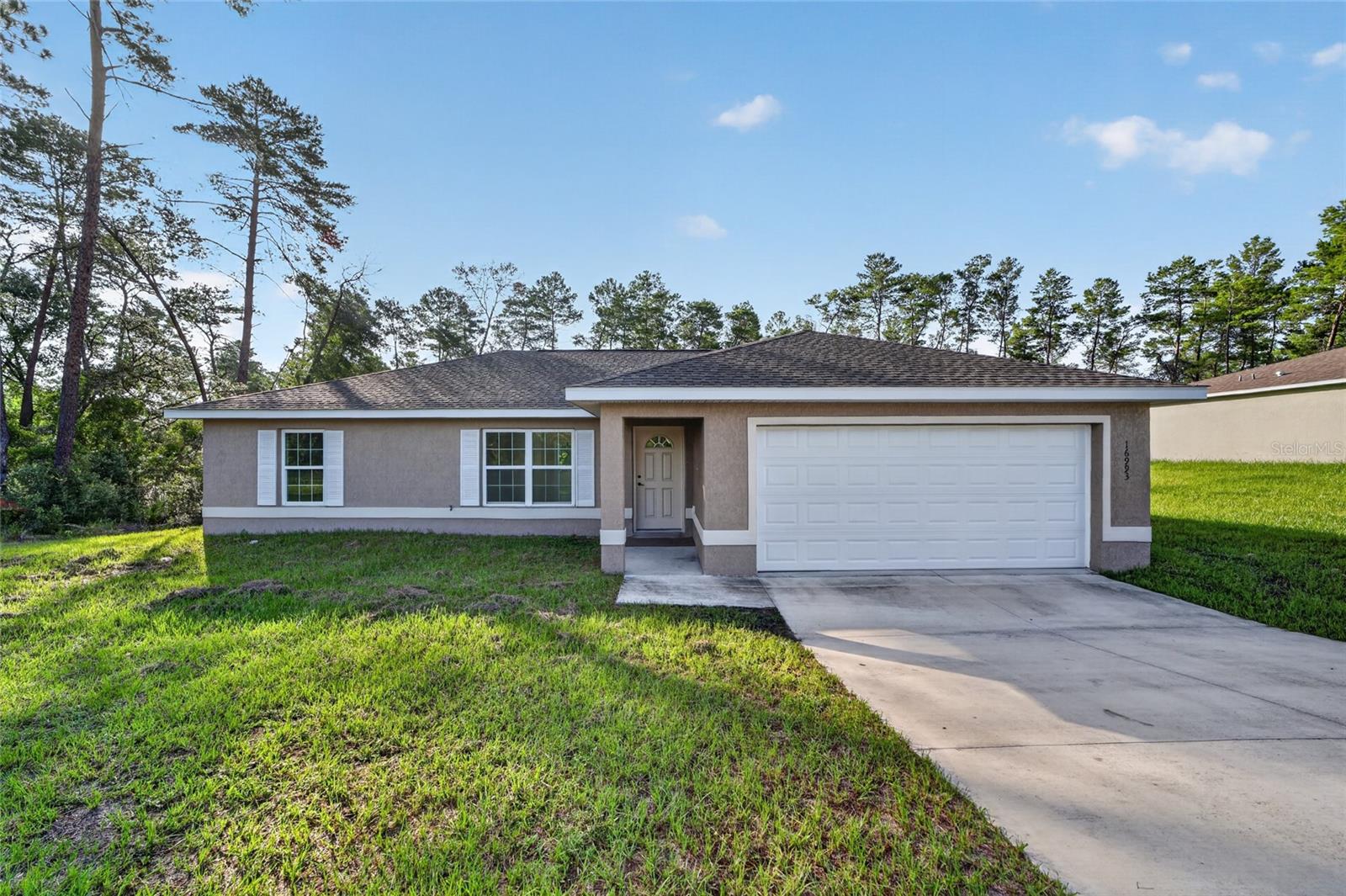Lovely 3/2 newer home ready for your occupancy.  Home was completely repainted inside with all new hardware.  Home is located near shopping inside Marion Oaks growing community. Marion Oaks is a deed restricted community but no required HOA.