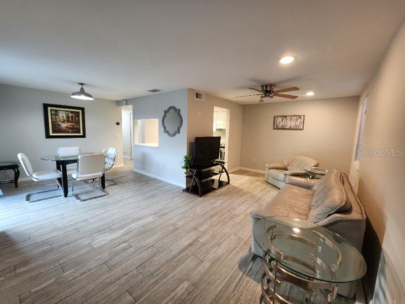 This meticulously designed 2-bedroom, 2-bathroom condo home offers the perfect blend of comfort and style. As you step into the spacious living area, you'll be a contemporary tasteful decor, creating an inviting atmosphere for you to unwind and entertain. The dining room leads to a private enclosed screened porch. One of the highlights of this condo is the access to a community pool. Imagine spending lazy afternoons by the poolside, soaking up the sun, and taking refreshing dips to escape the heat. It's the perfect place to relax and socialize with neighbors. This is the ideal choice for those seeking a hassle-free and comfortable living experience. Don't miss the opportunity to make this welcoming space your home. Cedar Woods is a 55+ Community located near Sun Seekers Resort, shopping, restaurants, Punta Gorda Farmers market, gulf courses, and more.