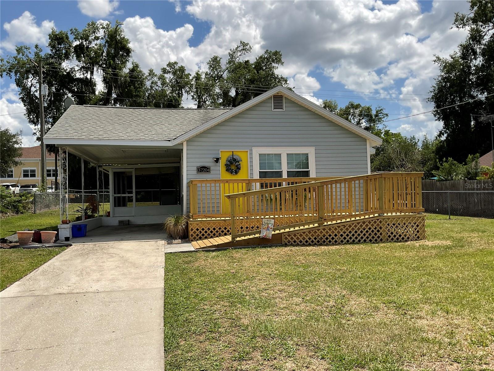 Adorable bungalow in Dade City.  This home sits on a large lot with a fenced back yard, one car carport and a 18x10 side screen patio.  2 bedrooms, 1 bath with an open floor plan would make a great starter home or retirement home. Conveniently located to downtown events and shopping.  Easy to show!!