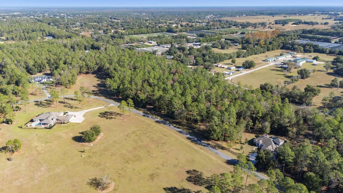 Discover a secluded haven within the esteemed equestrian enclave of Lakewood Ranches, where expansive horizons, gently sweeping pastureland, and peaceful riding trails set the stage for an inspired country lifestyle. Encompassing and impressive 5 acres, this remarkable estate lot offers an uncommon opportunity to design a bespoke retreat, from an elegant custom residence with a resort-style pool to a fully realized equestrian compound. Two new deepwater wells and electricity are already on-site. Approved for horses and limited cattle, the property provides abundant room for stables, paddocks and auxiliary structures while maintaining a sense of openness and privacy. Envision early-morning rides through the community, refined outdoor entertaining or unhurried days immersed in the natural surroundings of your own acreage. With only 149 homes, Lakewood Ranches balances quiet pastoral living with proximity to boutiques, dining in Mt. Dora and Tavares, also within easy reach of Sorrento and the Harris Chain of Lakes. Convenient access to SR 44 and the 429 beltway ensures seamless connectivity to greater Orlando and beyond. This is not simply land, but an opportunity to curate a distinctive way of life, an increasingly scarce chance to bring to life the equestrian estate or private countryside escape you have long imagined.