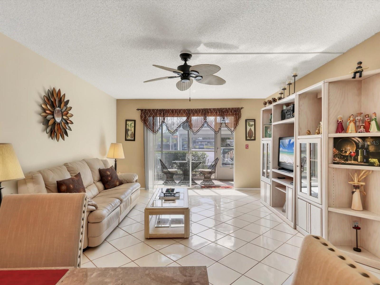 This charming, super clean and very well taken care of 2-bedroom, 2-bathroom condo is now available in Glen Oaks, a vibrant 55+ community with a great central Sarasota location close to downtown, UTC Mall, restaurants, shopping, dog parks,  fabulous golf courses, and world-renowned beaches. This updated home features stylish ceramic tile throughout, a bright and airy layout, and a wonderful sunny south-facing all-weather patio perfect for morning coffee. Enjoy a large heated community pool, shuffleboard courts, barbecue grills, a fantastic clubhouse, a tropical courtyard entryway, covered parking, and plenty of guest spaces. Additional appointments include an updated kitchen with extra counter space and light wood cabinetry, updated baths with beautifully tiled showers, modern finishes, stylish vanities and fixtures, fans in all rooms, lots of closet space, and extra storage for beach chairs and holiday items. Glen Oaks has a minimum rental policy, strong reserves, reasonable fees, no assessments, and is up to date on all newly required inspections. Move-in ready and located on the 1st floor, this condo offers comfort, ease of use, and a quiet retreat in the middle of it all. Make this your new vacation home or enjoy year-round living. Schedule your showing today.