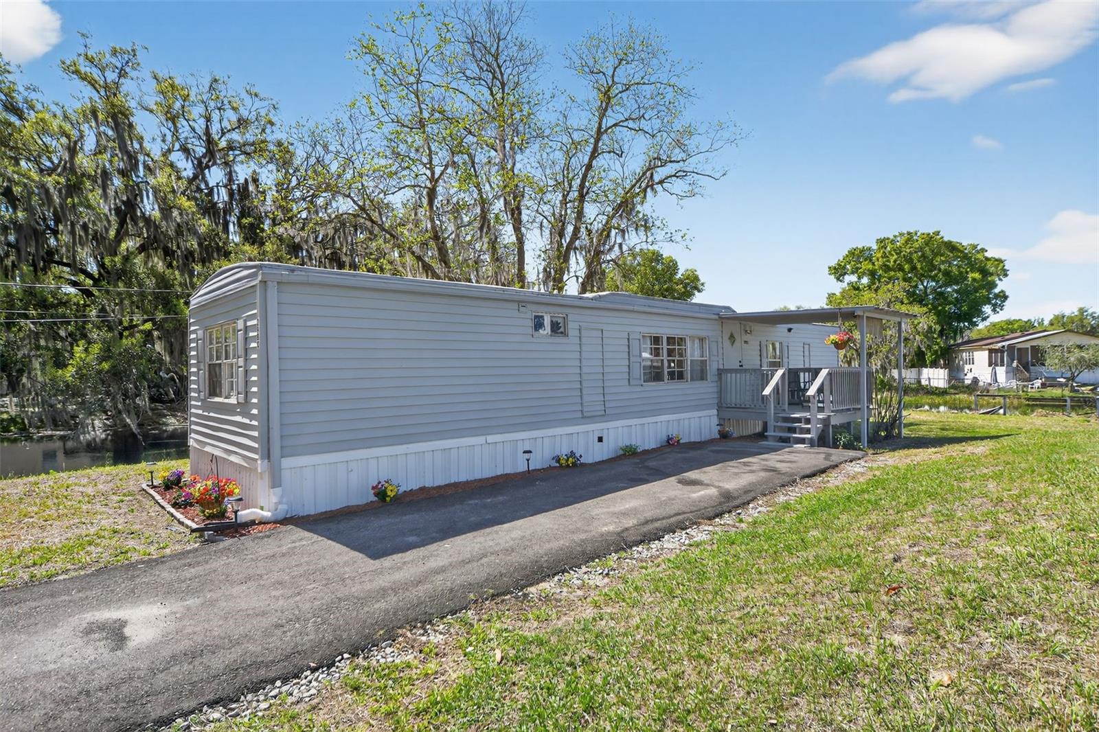 **Seller is Motivated to sell*** Waterfront living, major upgrades, and investment potential come together in this beautifully refreshed canal front property with direct access to the 2,000 acre private Lake Lowery. Whether you are looking for a primary residence, weekend fishing retreat, or income producing opportunity, this move in ready home offers the lifestyle, flexibility, and value buyers want.
Thoughtfully updated for comfort and peace of mind, the home features a newer roof completed in 2024, energy efficient A/C system in 2021, hot water heater and upgraded insulation in 2021, newer septic system in 2021, and hurricane strapping and stabilizers added in 2025. Inside, you will find luxury vinyl plank flooring throughout, a remodeled kitchen, two renovated bathrooms, updated electrical fixtures, and fresh interior paint that creates a bright, clean, modern feel.
Outside, the appeal continues with fresh exterior paint, updated skirting, a paved driveway completed in 2024, a newly installed fence for added privacy, and a spacious deck overlooking the canal that is perfect for relaxing or entertaining.
Conveniently located near shopping, dining, and Central Florida attractions, this property offers the perfect balance of peaceful waterfront living and everyday convenience. Schedule your private showing today.